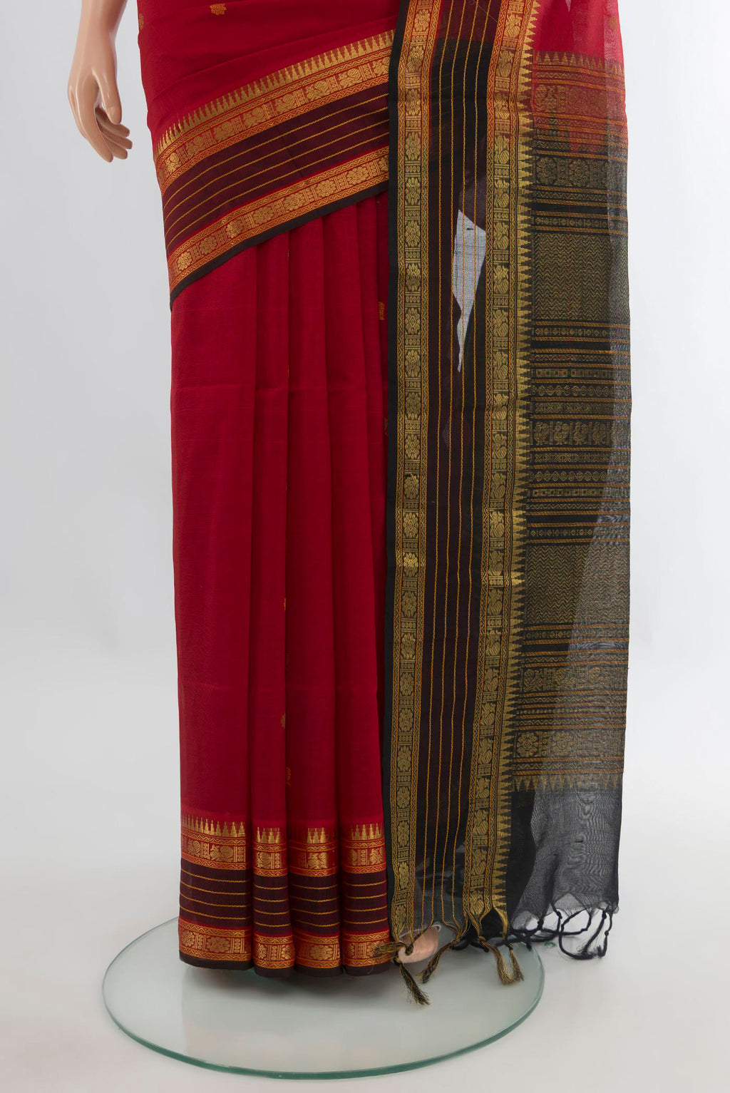 Pleats and pallu of Red Silk Cotton Saree with Zari Butta on the body and Zari Border. 