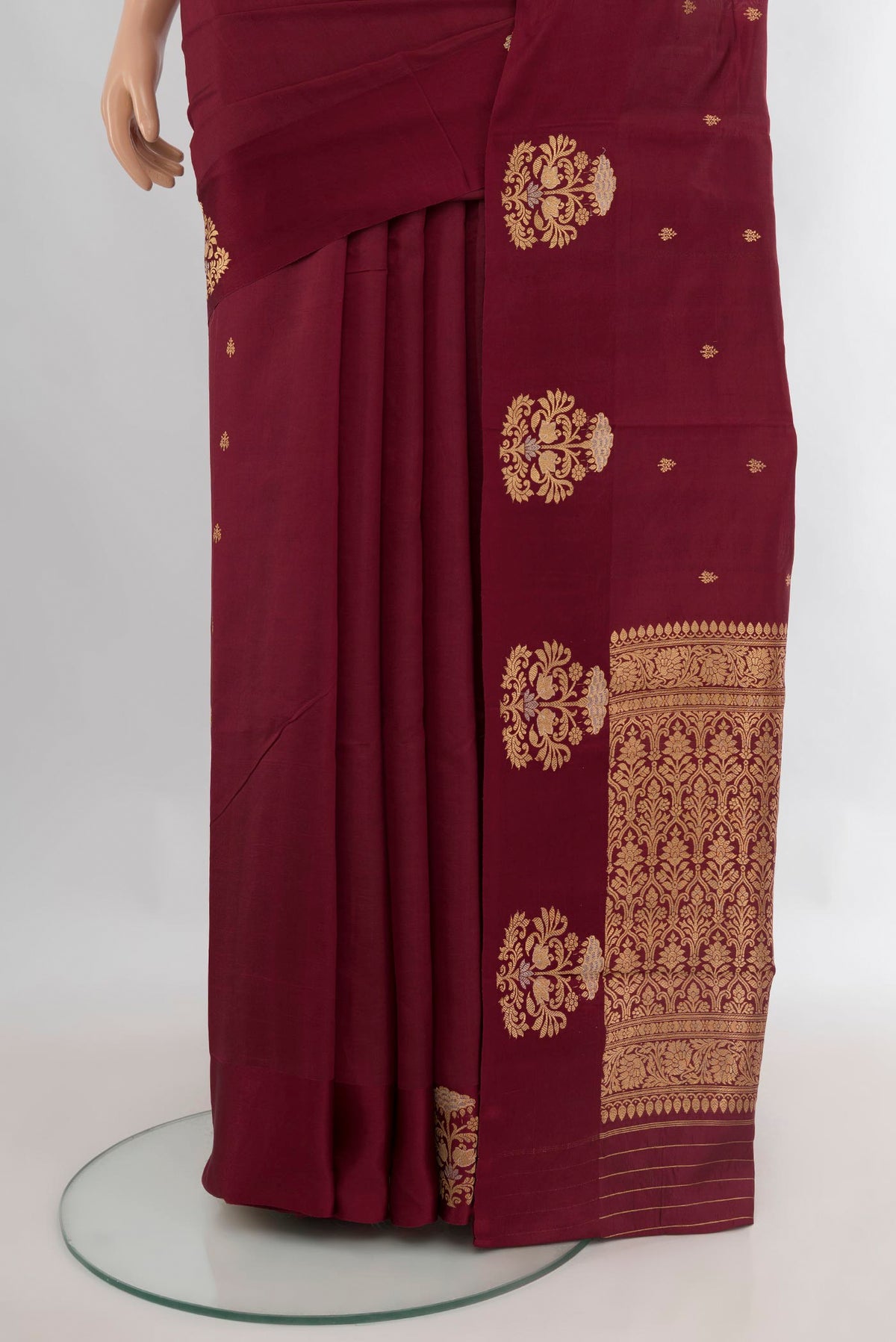 Pleats and pallu of Pure Silk Coffee Brown Banarasi Katan Saree with Zari Butta on the body and Plain Border. 