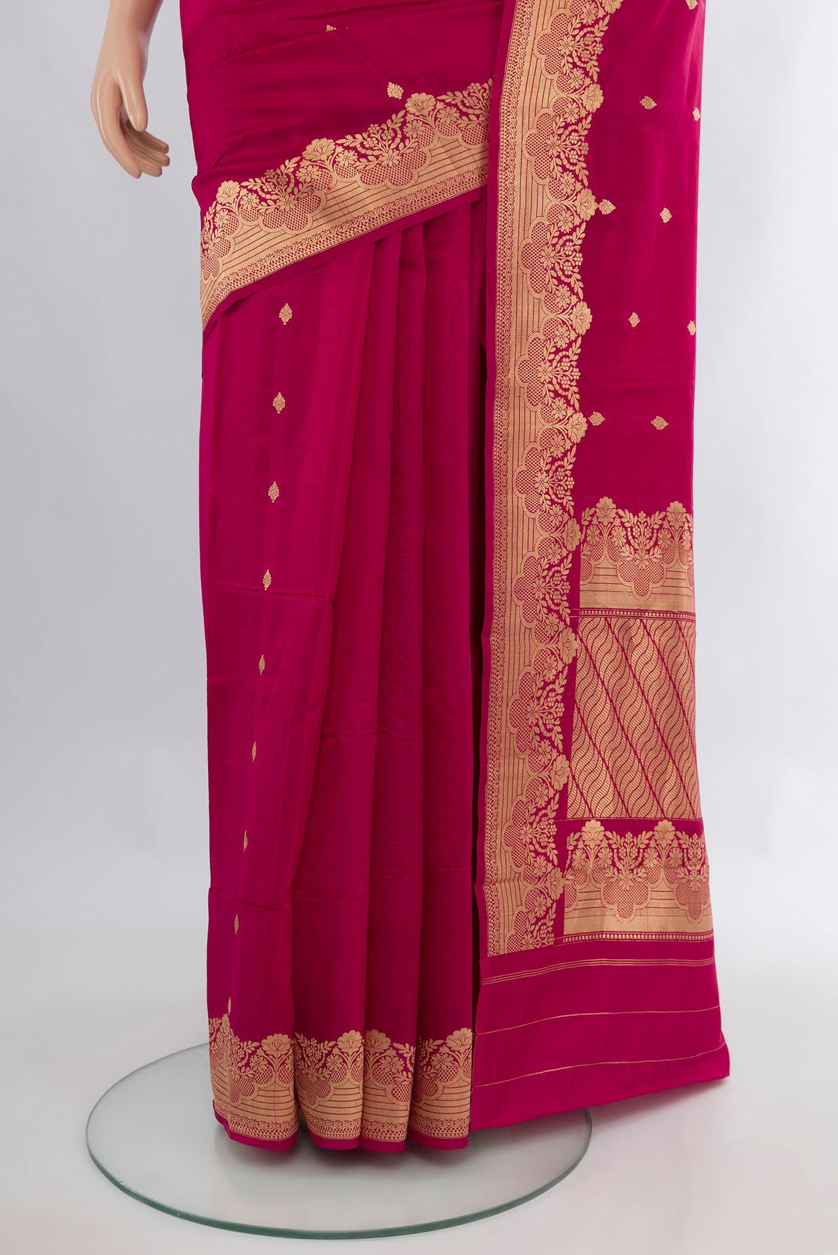 Pleats and pallu of Pure Silk Dark Pink Banarasi Katan Saree with Zari Butta on the body and Plain Border. 
