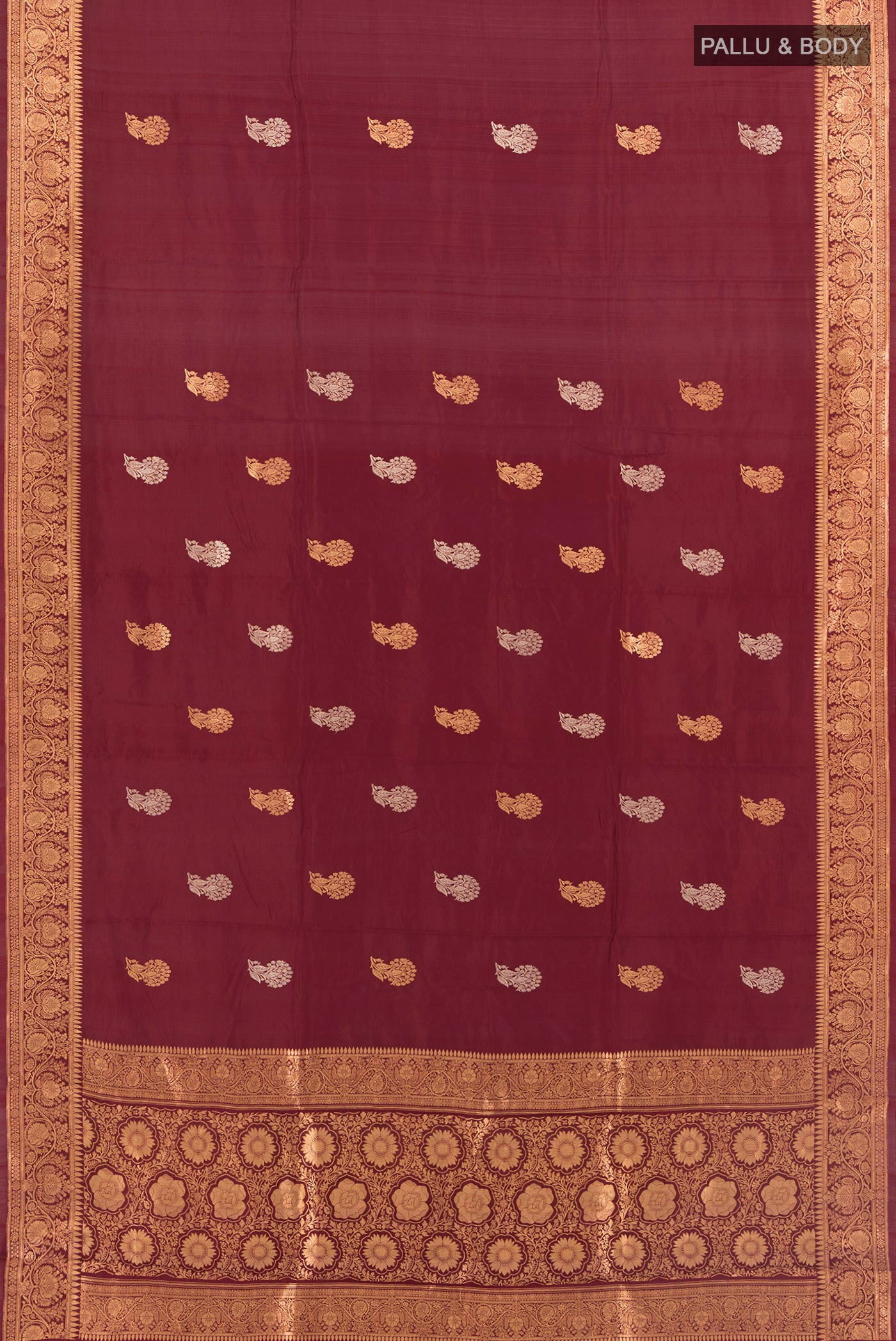 Flat view of Maroon Banarasi Katan Silk Saree with Zari Butta on the body and Zari Border. 