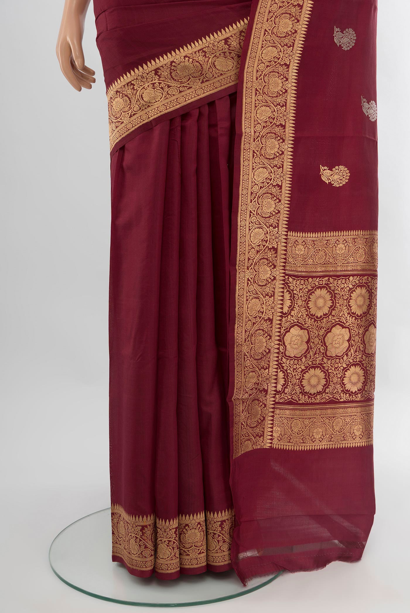 Pleats and pallu of Maroon Banarasi Katan Silk Saree with Zari Butta on the body and Zari Border. 