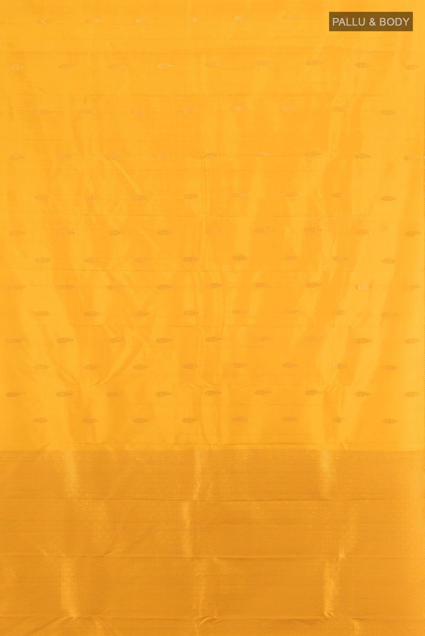 Flat view of Yellow Kanjivaram Silk Saree with Zari Butta on the body and Zari Border. 