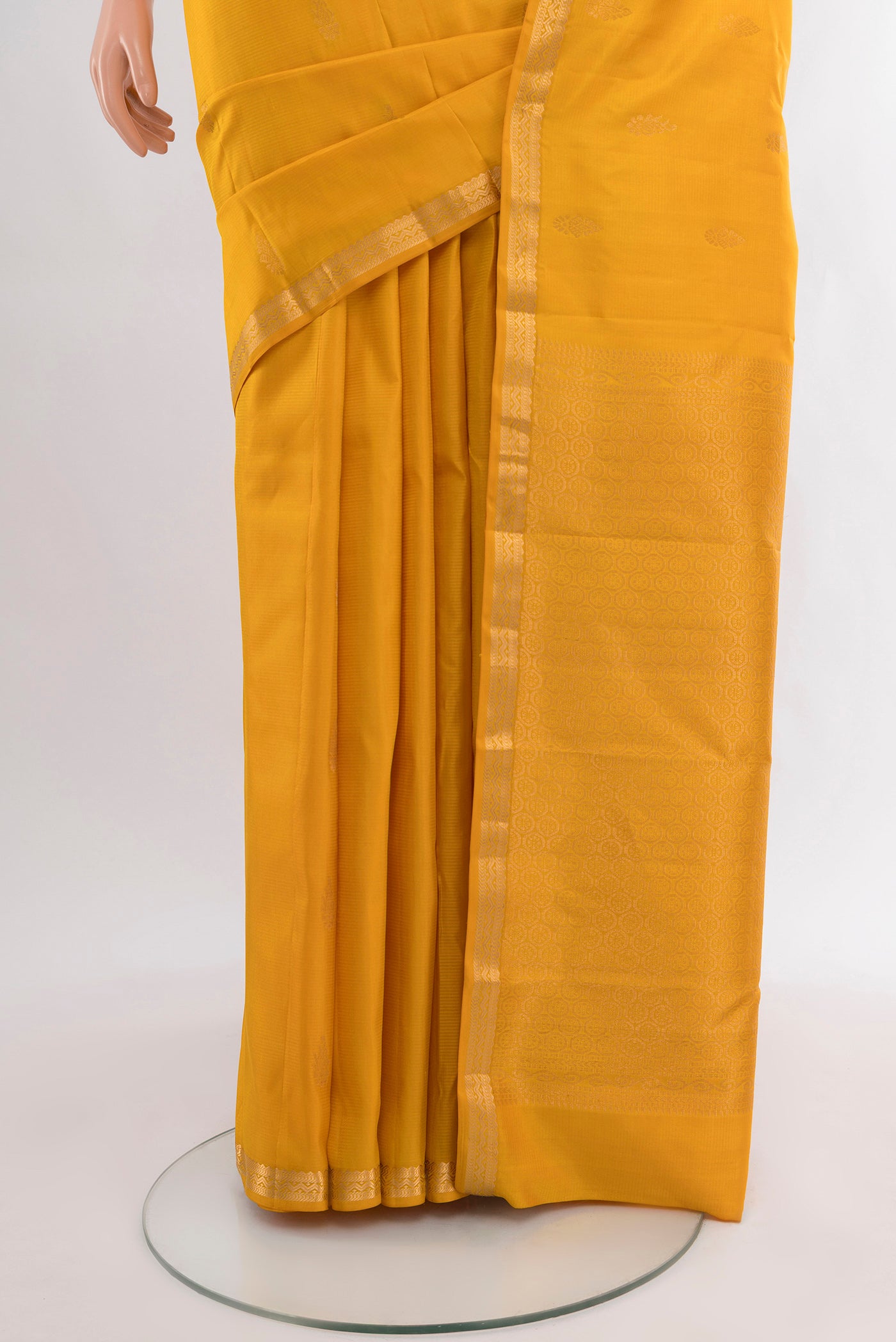 Pleats and pallu of Yellow Kanjivaram Silk Saree with Zari Butta on the body and Zari Border. 