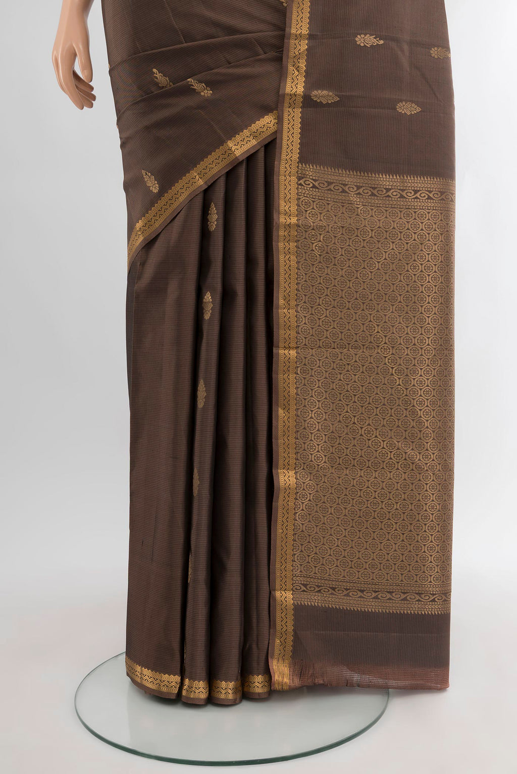 Pleats and pallu of Brown Kanjivaram Silk Saree with Zari Butta on the body and Zari Border. 