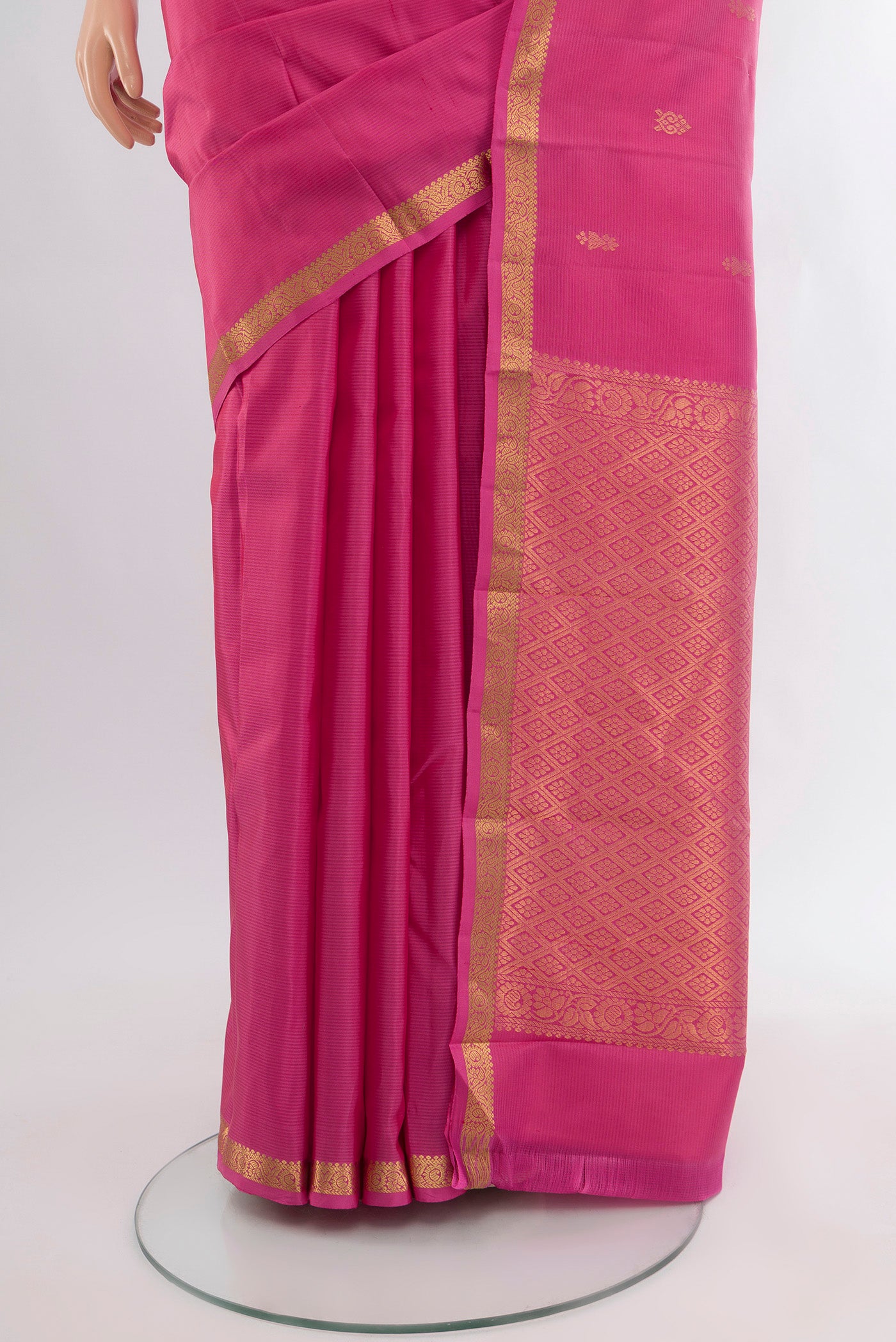 Pleats and pallu of Rose pink Kanjivaram Silk Saree with Zari Butta on the body and Zari Border. 