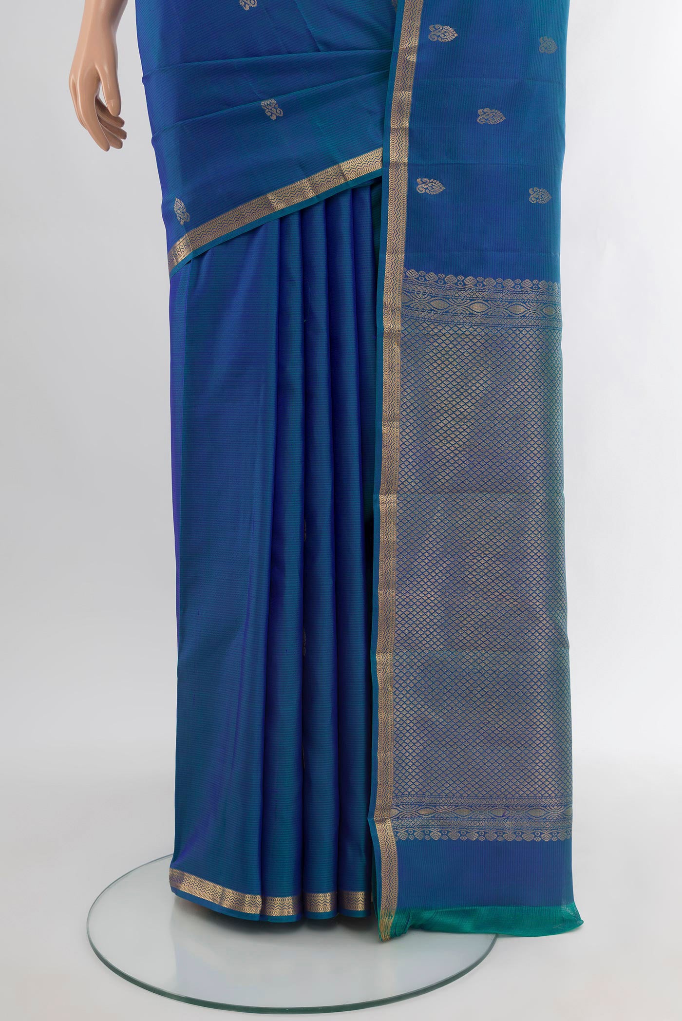 Pleats and pallu of Peacock Blue Kanjivaram Silk Saree with Zari Butta on the body and Zari Border. 