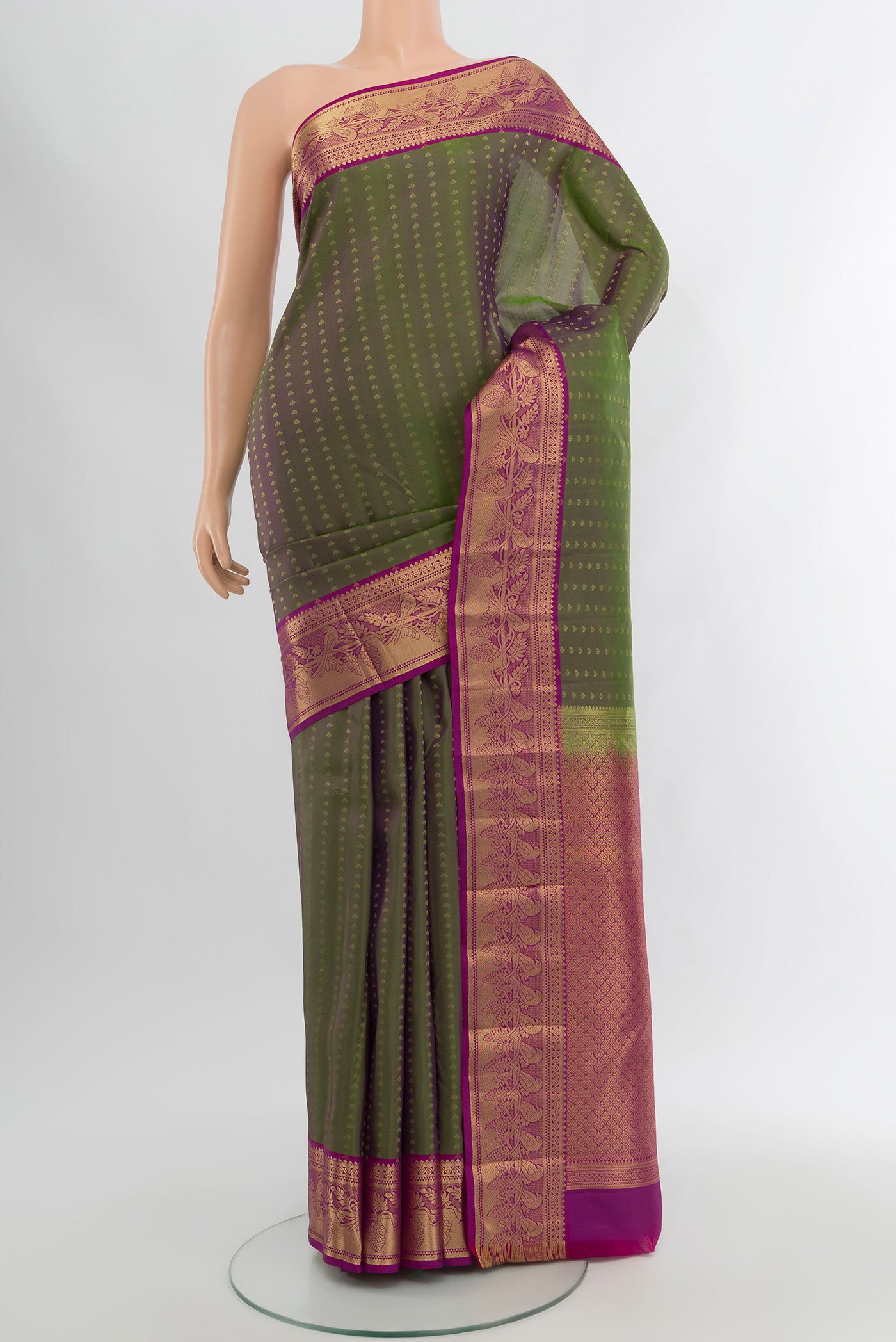 Multi Color Kanchipuram Silk Saree with Zari Butta on the body and Zari Border.  displayed on a mannequin