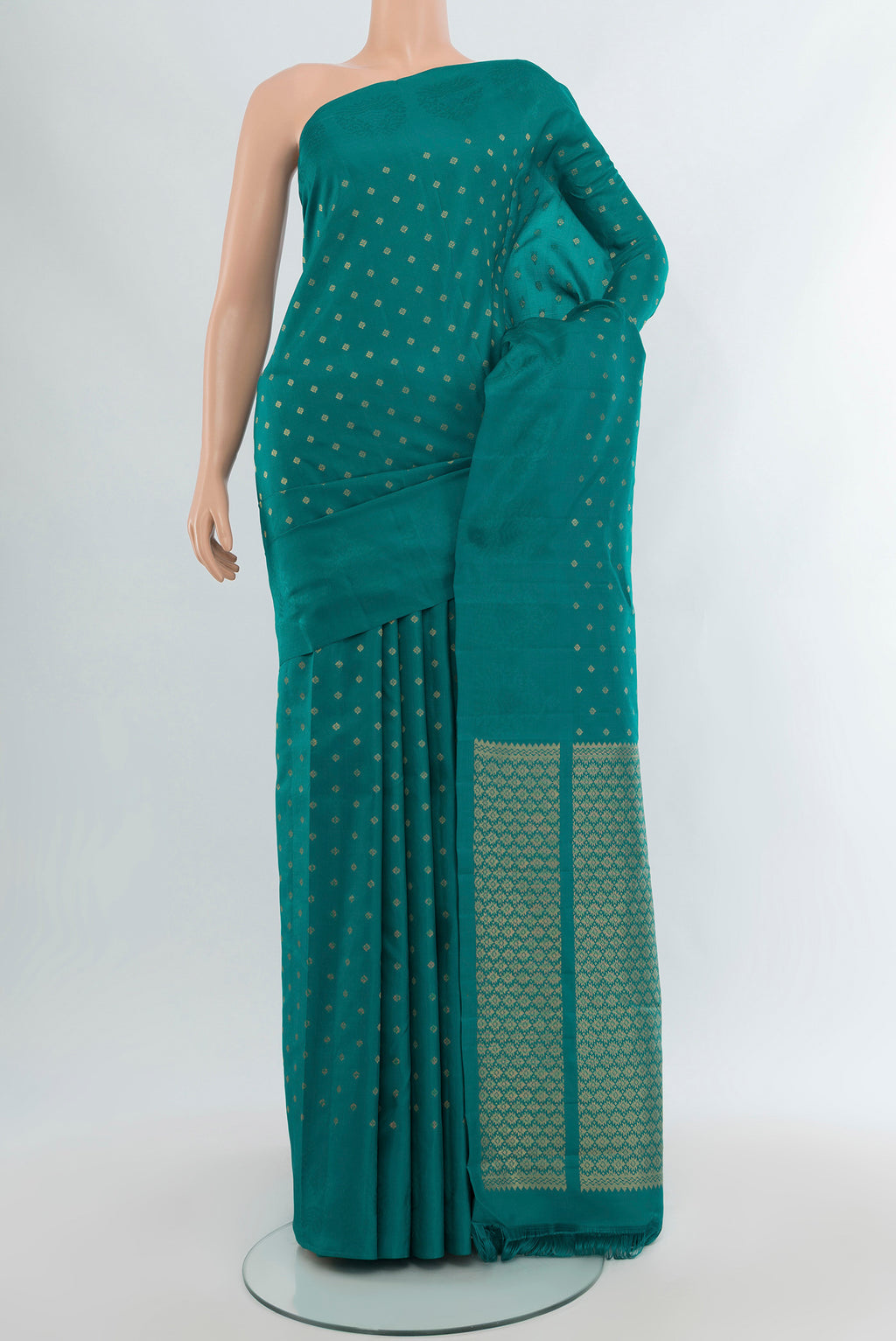 Peacock Blue Kanchipuram Silk Saree with Zari Butta on the body and Without Border.  displayed on a mannequin