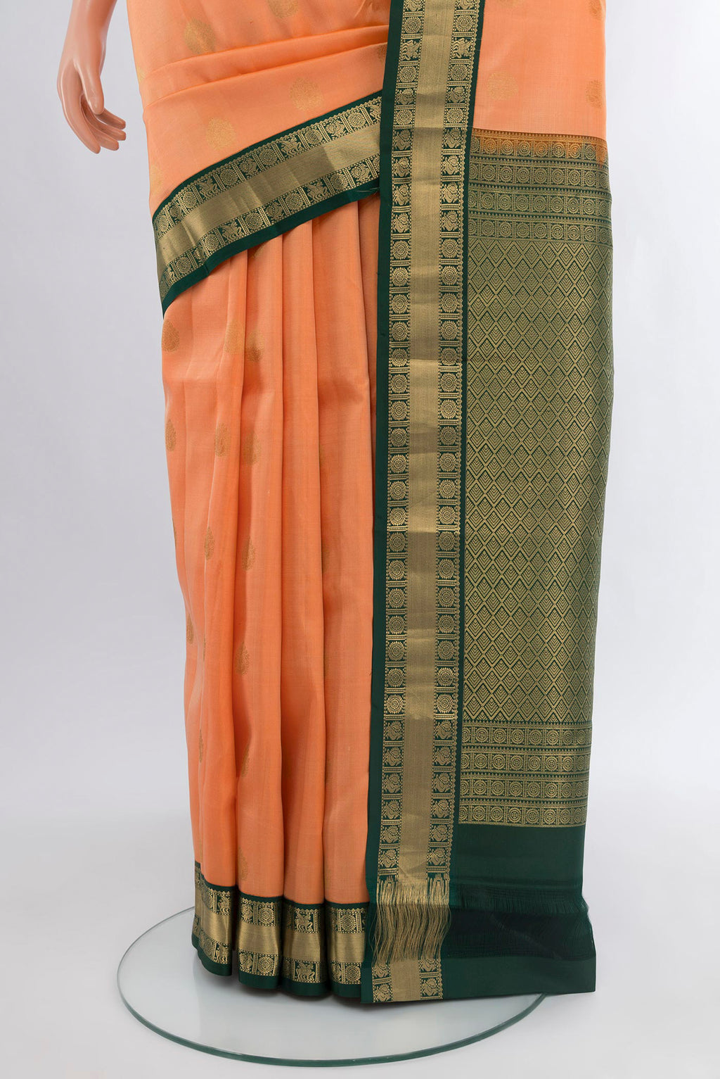 Pleats and pallu of Peach Kanchipuram Silk Saree with Zari Butta on the body and Zari Border. 