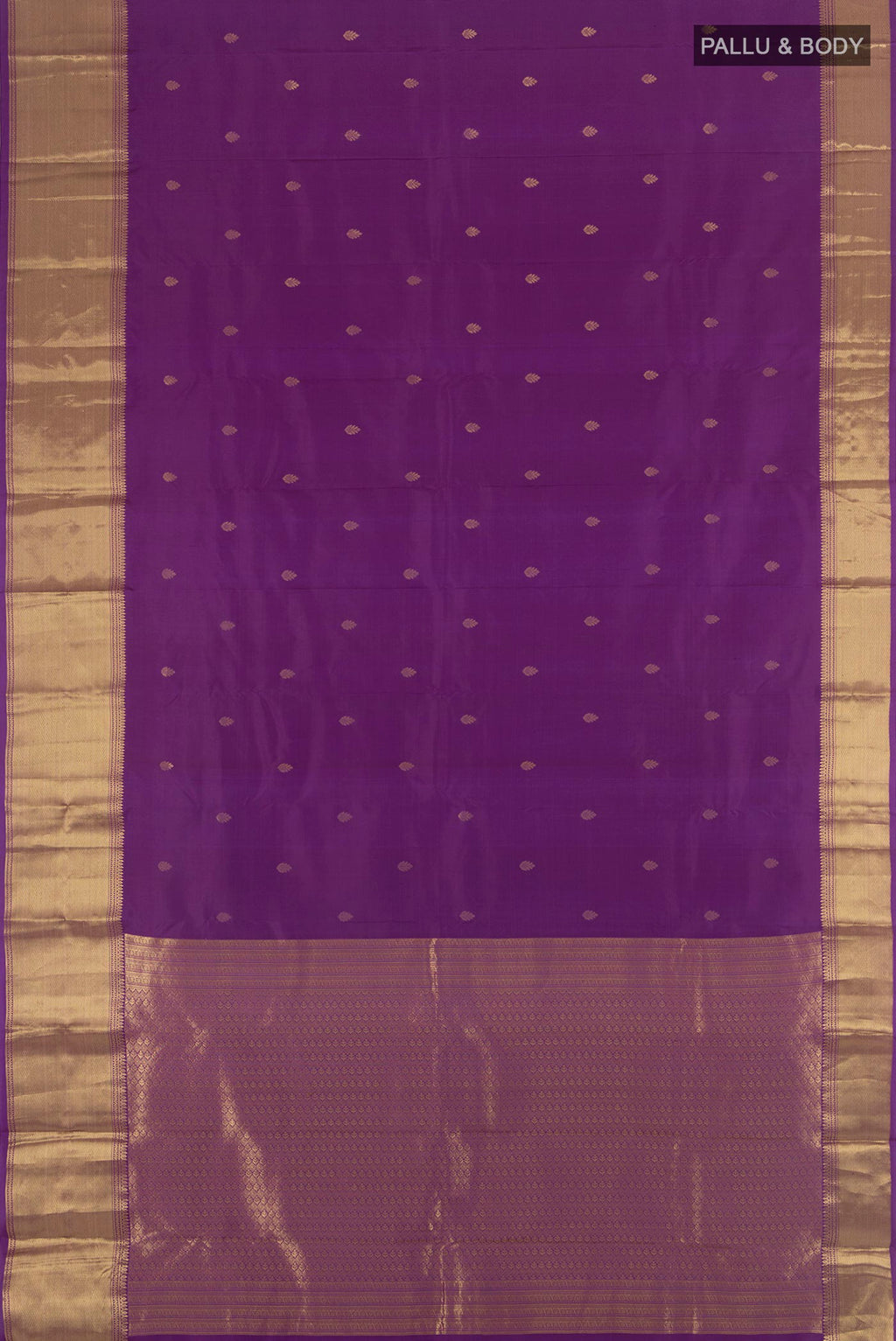 Flat view of Violet Kanchipuram Silk Saree with Zari Butta on the body and Zari Border. 