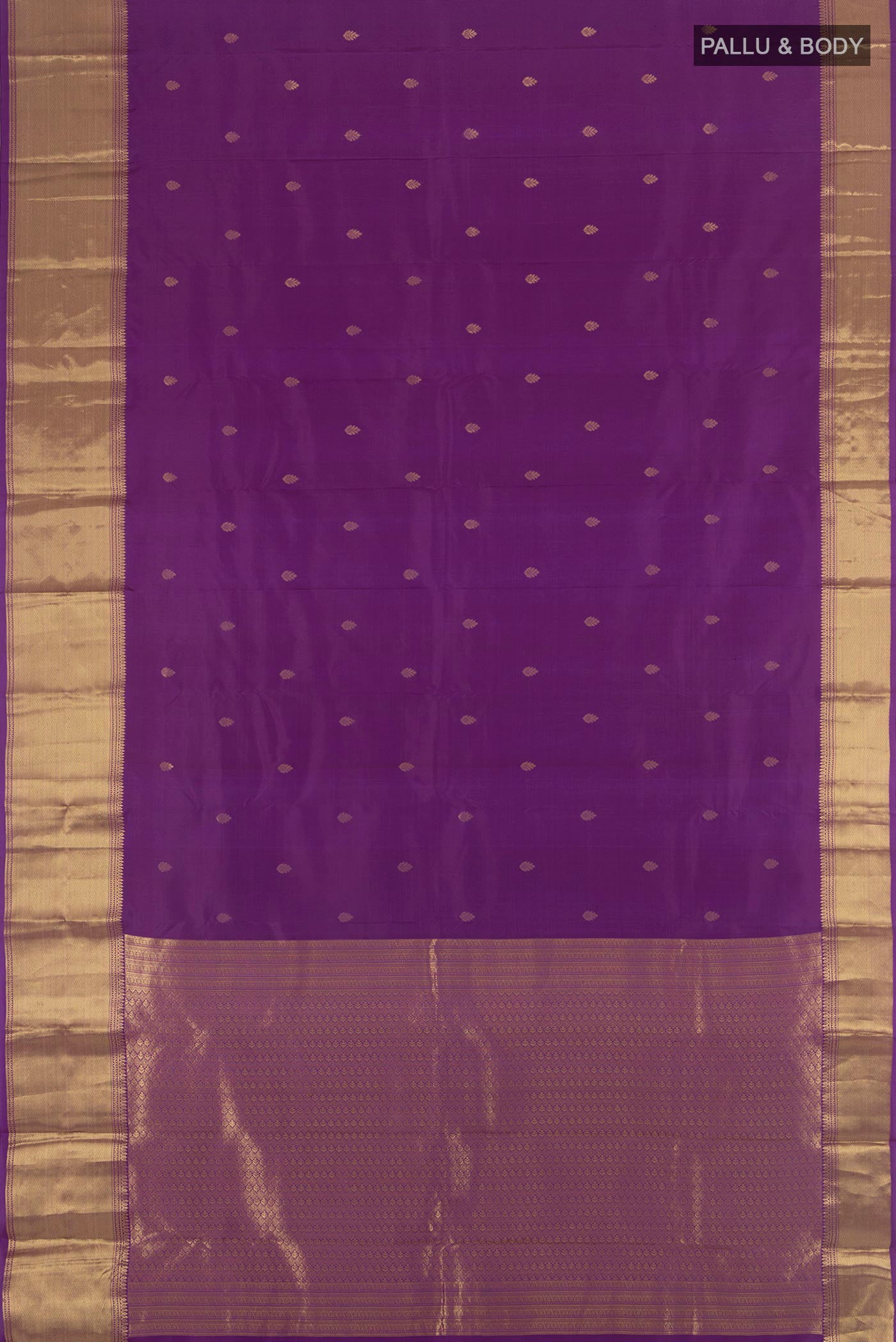 Flat view of Violet Kanchipuram Silk Saree with Zari Butta on the body and Zari Border. 