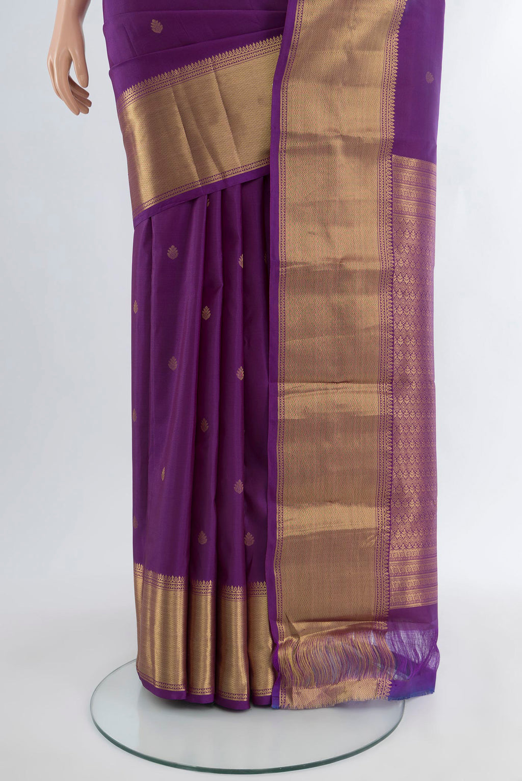 Pleats and pallu of Violet Kanchipuram Silk Saree with Zari Butta on the body and Zari Border. 