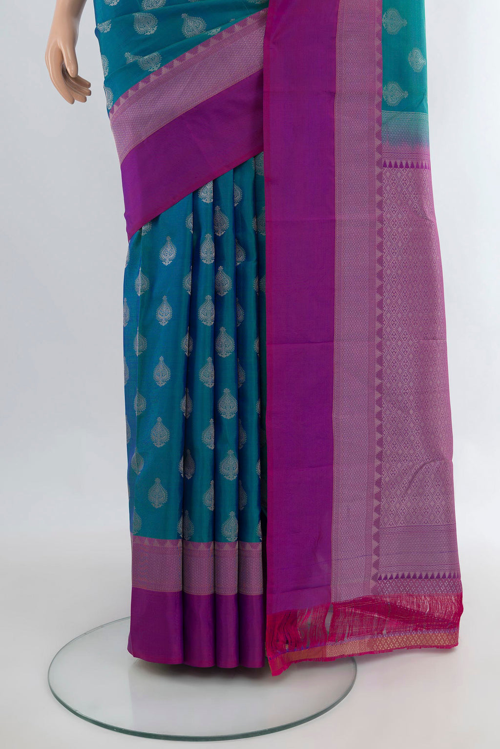 Pleats and pallu of Pure Silk Peacock Blue Kanchipuram Saree with Zari Butta on the body and Zari Border. 
