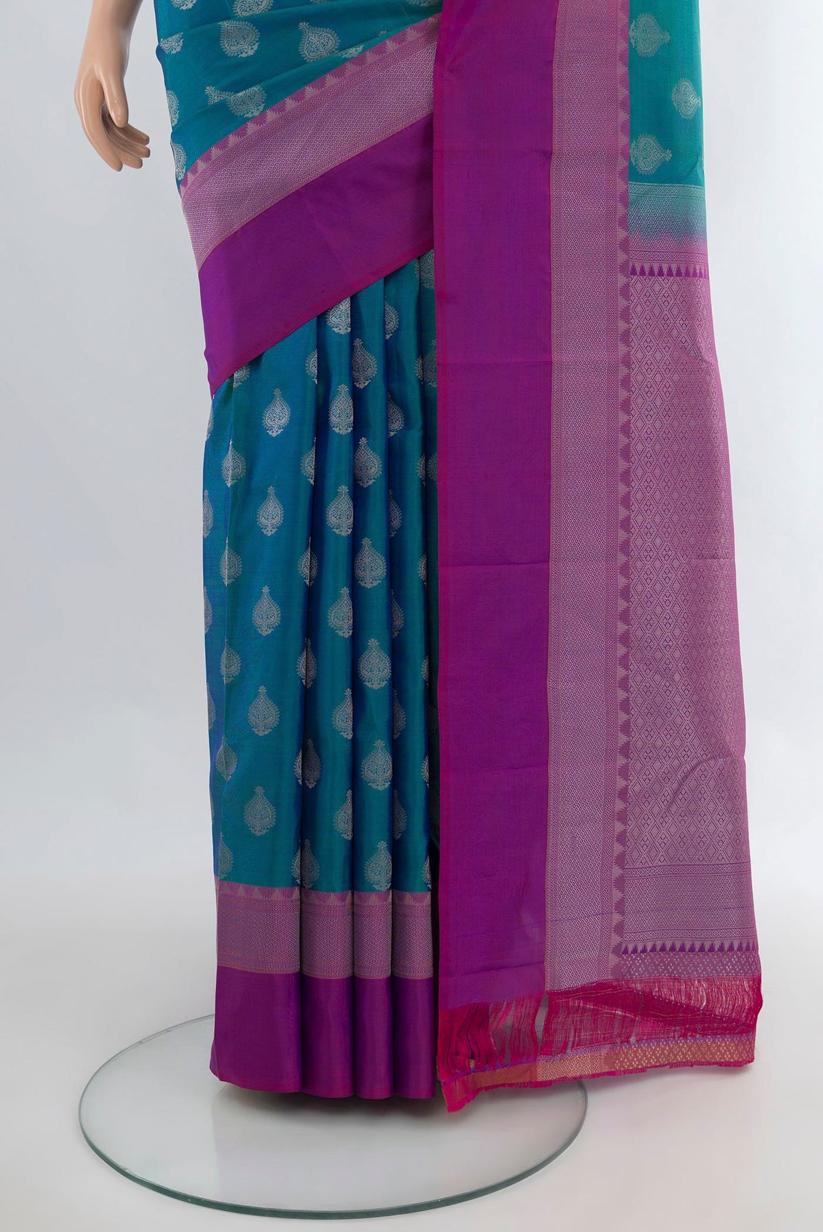 Pleats and pallu of Pure Silk Peacock Blue Kanchipuram Saree with Zari Butta on the body and Zari Border. 