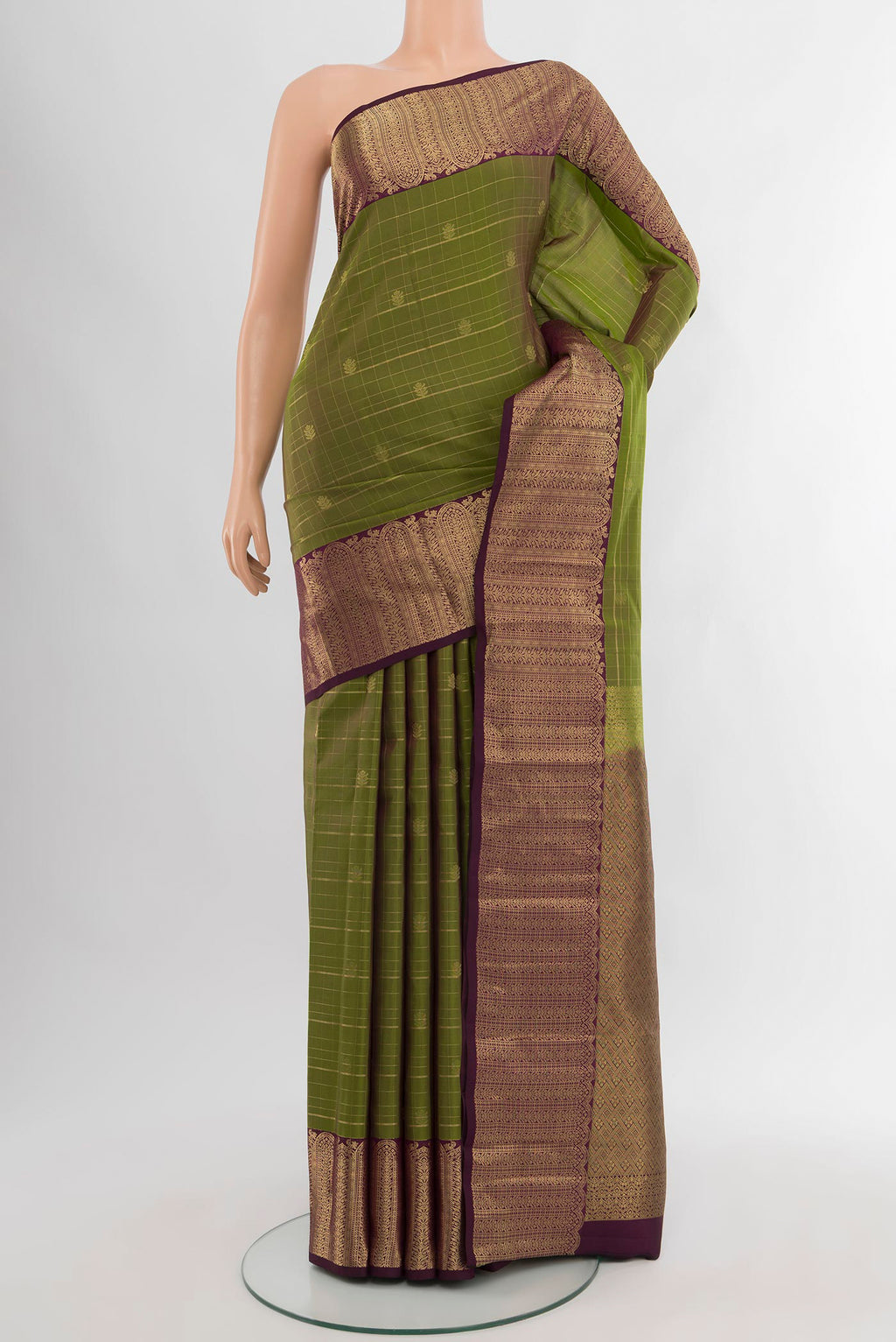 Mehandi Green Kanjivaram Silk Saree with Checked design on the body and Zari Border.  displayed on a mannequin