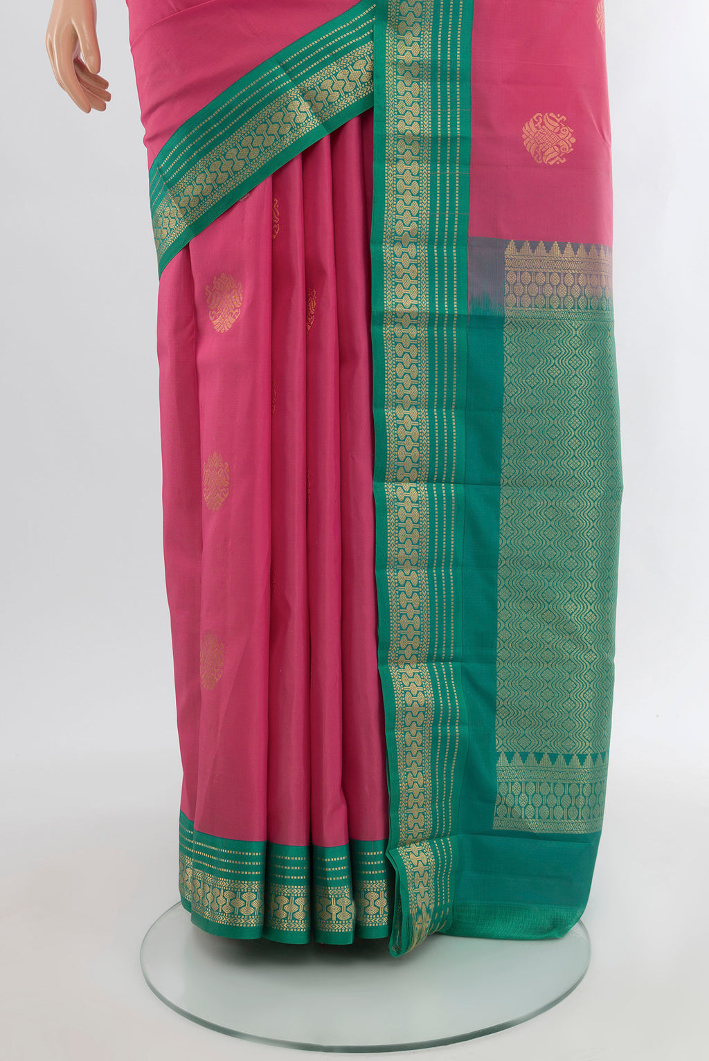 Pleats and pallu of Bronze Kanchipuram Silk Saree with Zari Butta on the body and Silk Border. 