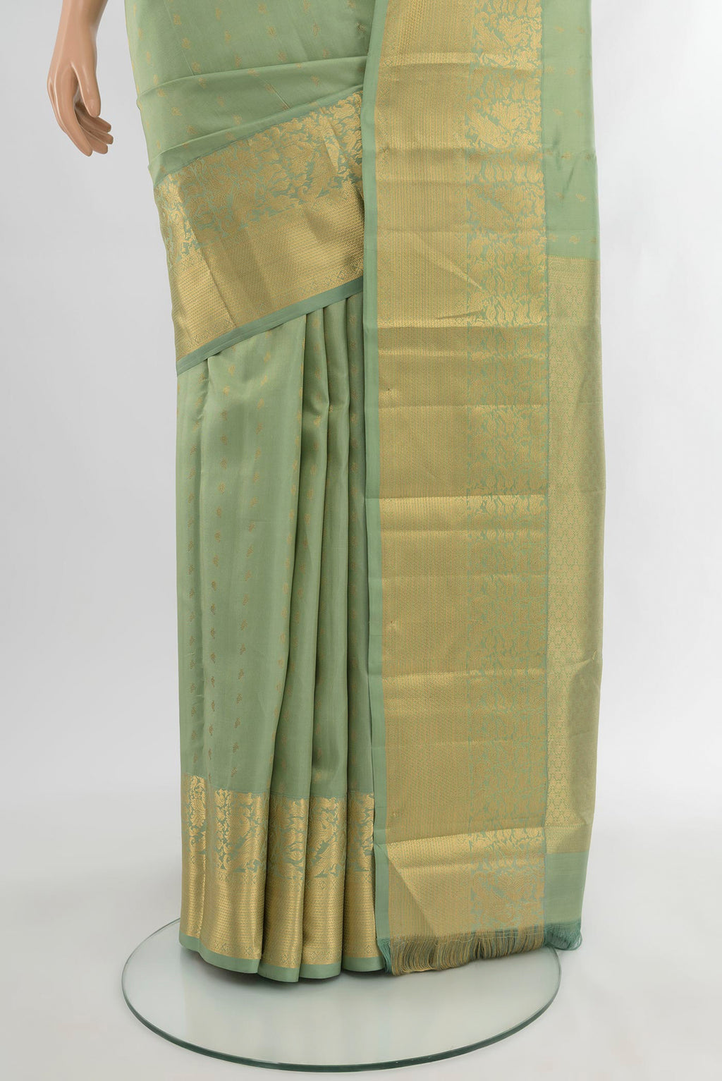 Pleats and pallu of Light Green Kanchipuram Silk Saree with Zari Butta on the body and Zari Border. 