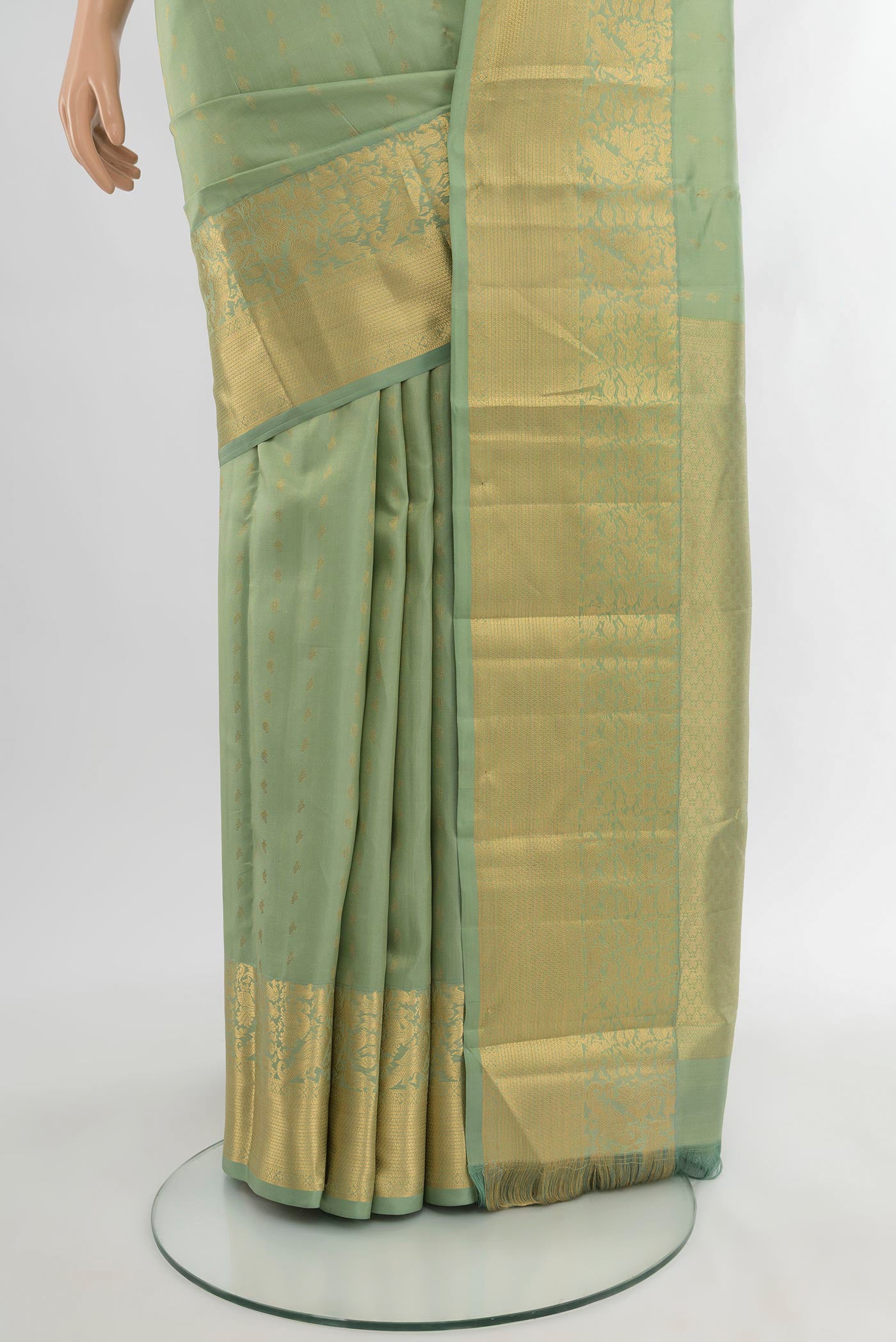 Pleats and pallu of Light Green Kanchipuram Silk Saree with Zari Butta on the body and Zari Border. 