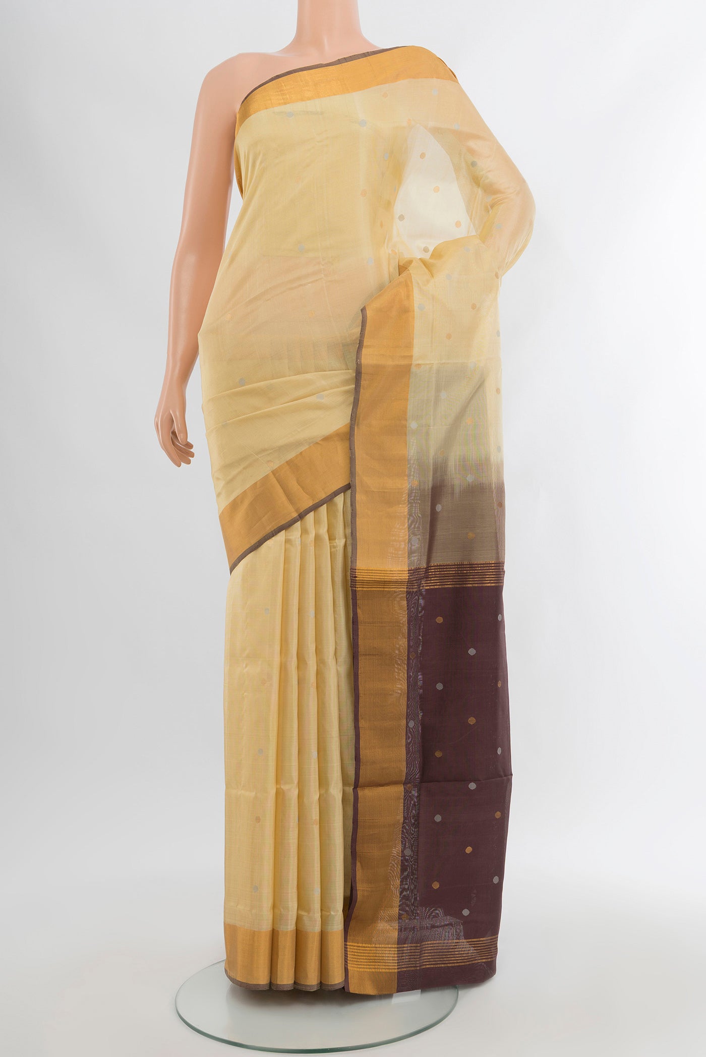 Cream Uppada Silk Saree with Zari Butta on the body and Silk Border.  displayed on a mannequin