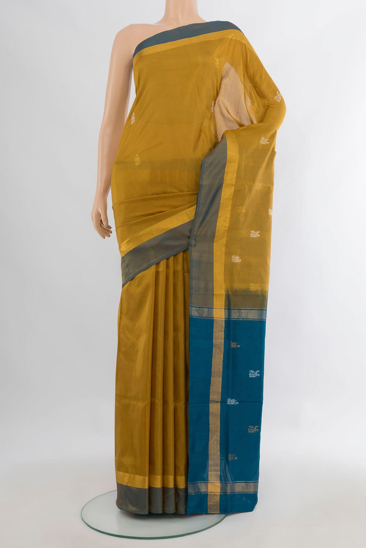 Pure Silk Mustard Uppada Saree with Zari Butta on the body and Zari Border.  displayed on a mannequin