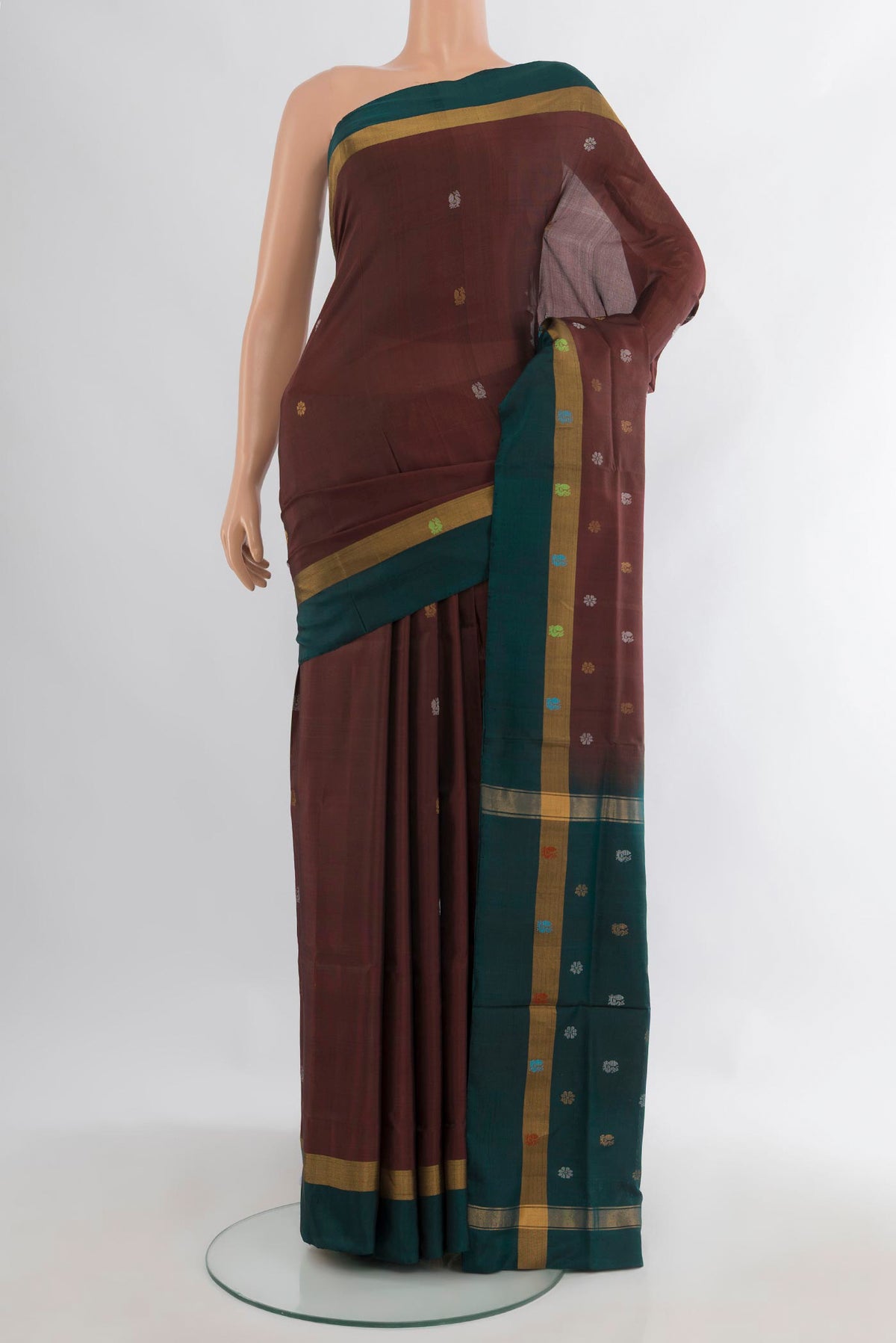 Pure Silk Coffee Brown Uppada Saree with Zari Butta on the body and Plain Border.  displayed on a mannequin