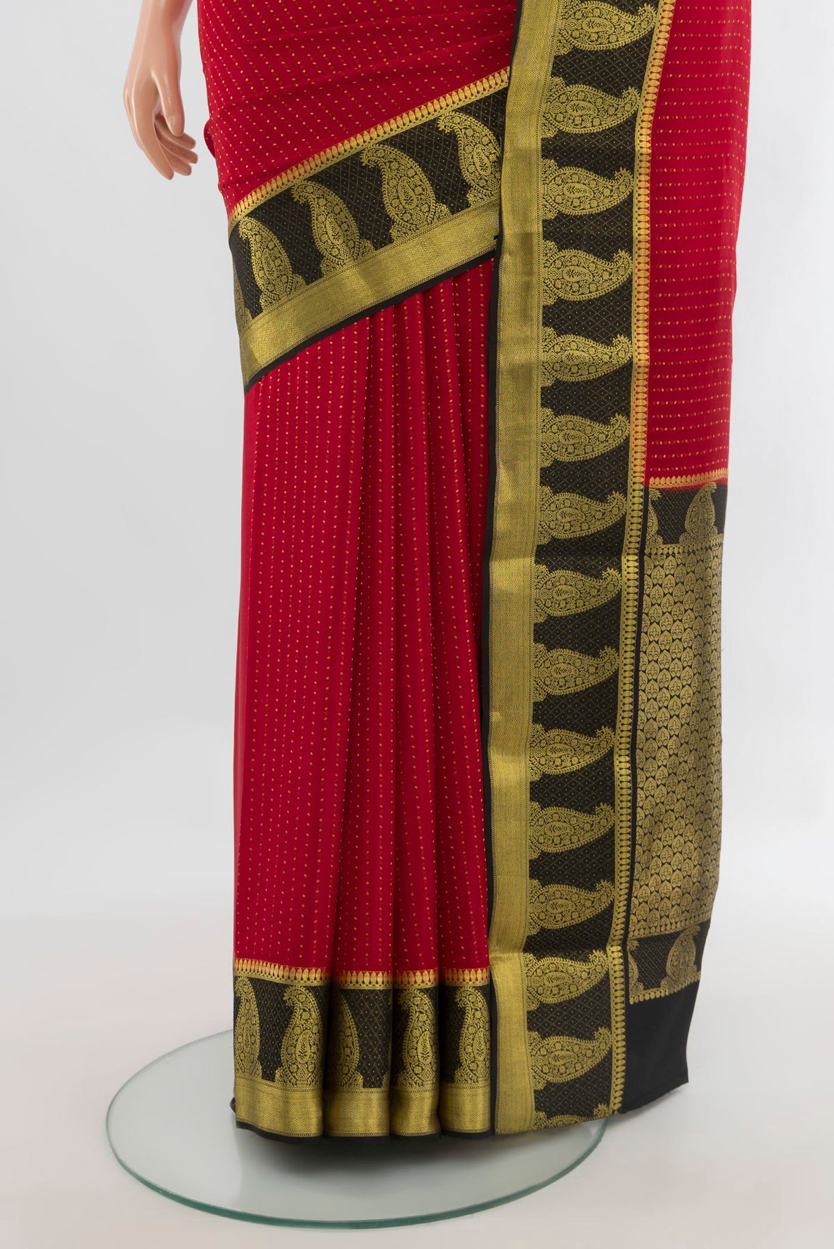 Pleats and pallu of Red Mysore Crepe Saree with Zari Butta on the body and Zari Border. 