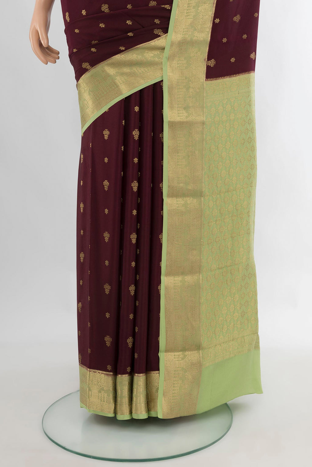 Pleats and pallu of Coffee Brown Mysore Crepe Saree with Plain Body and Zari Border. 