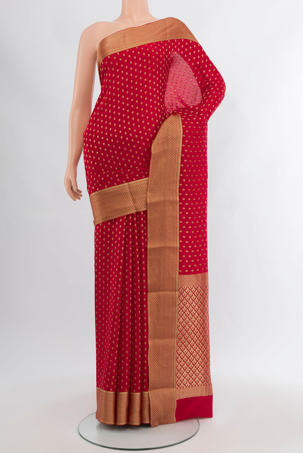 Red Mysore Crepe Saree with Zari Butta on the body and Zari Border.  displayed on a mannequin