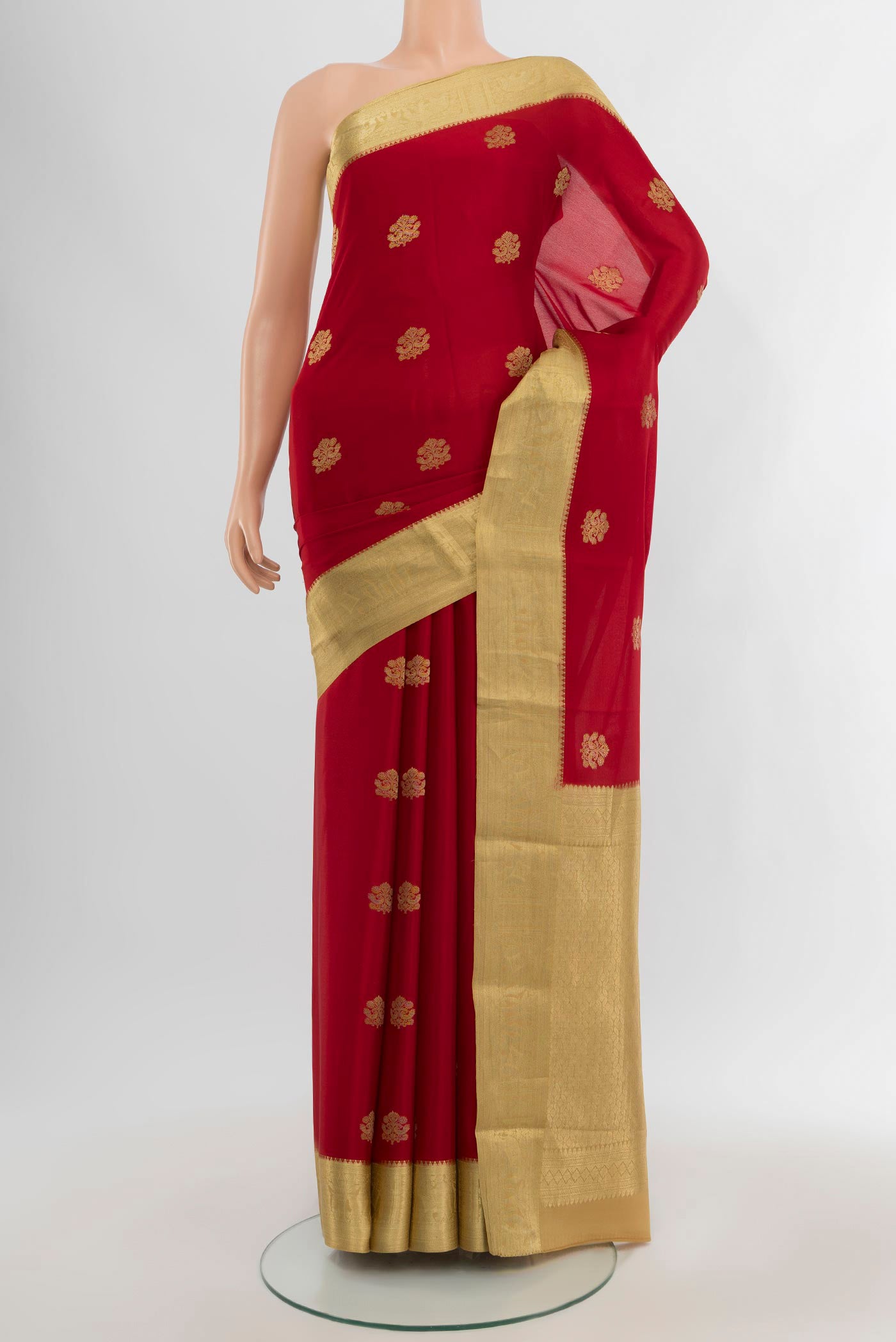 Red Mysore Crepe Saree with Zari Butta on the body and Zari Border.  displayed on a mannequin