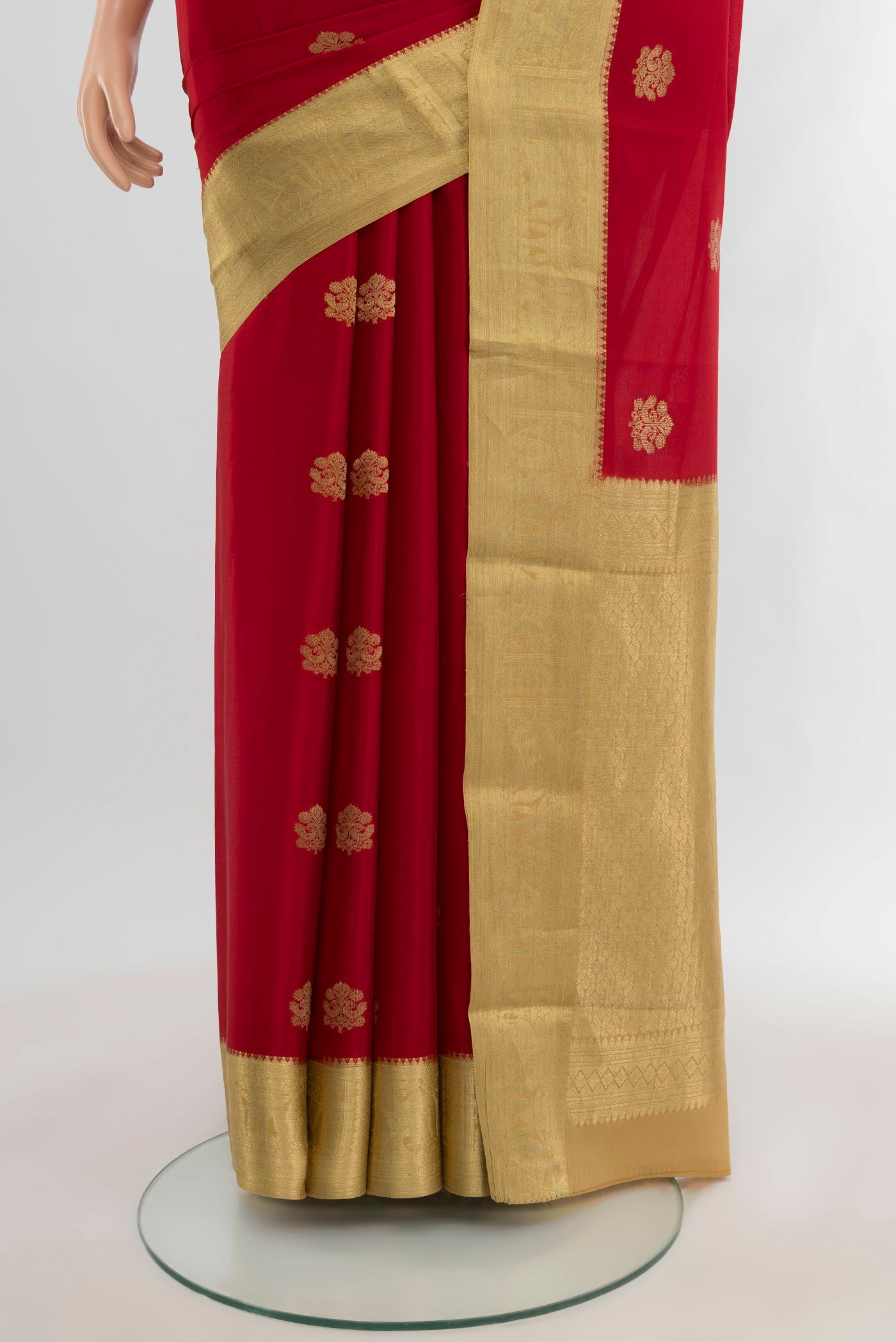 Pleats and pallu of Red Mysore Crepe Saree with Zari Butta on the body and Zari Border. 