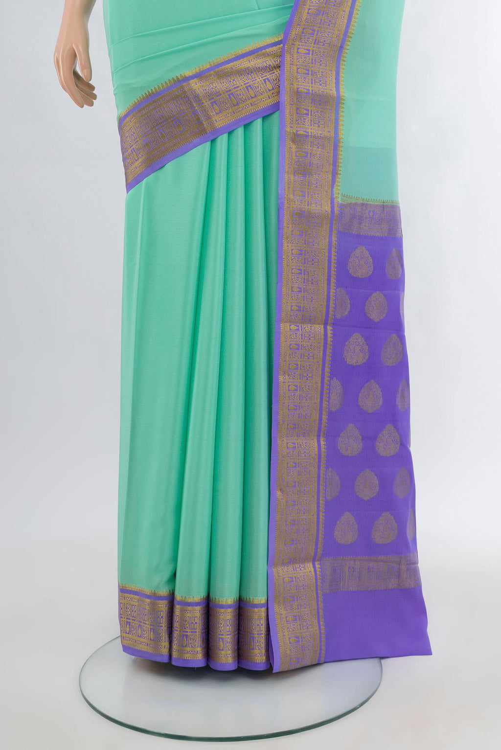 Pleats and pallu of Sea Green Mysore Crepe Saree with Plain Body and Zari Border. 