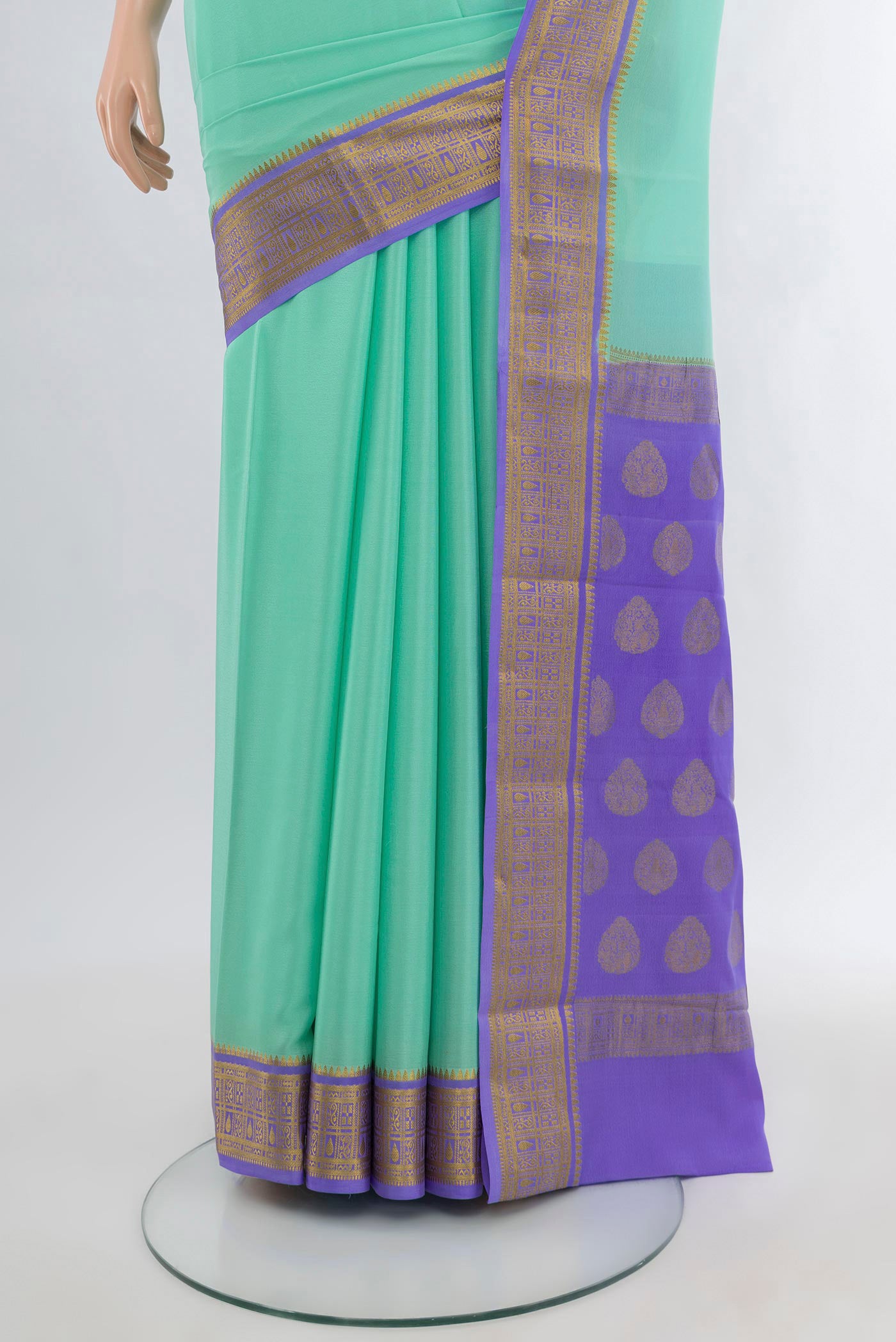 Pleats and pallu of Sea Green Mysore Crepe Saree with Plain Body and Zari Border. 