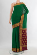 Green Mysore Crepe Saree with Plain Body and Zari Border.  displayed on a mannequin