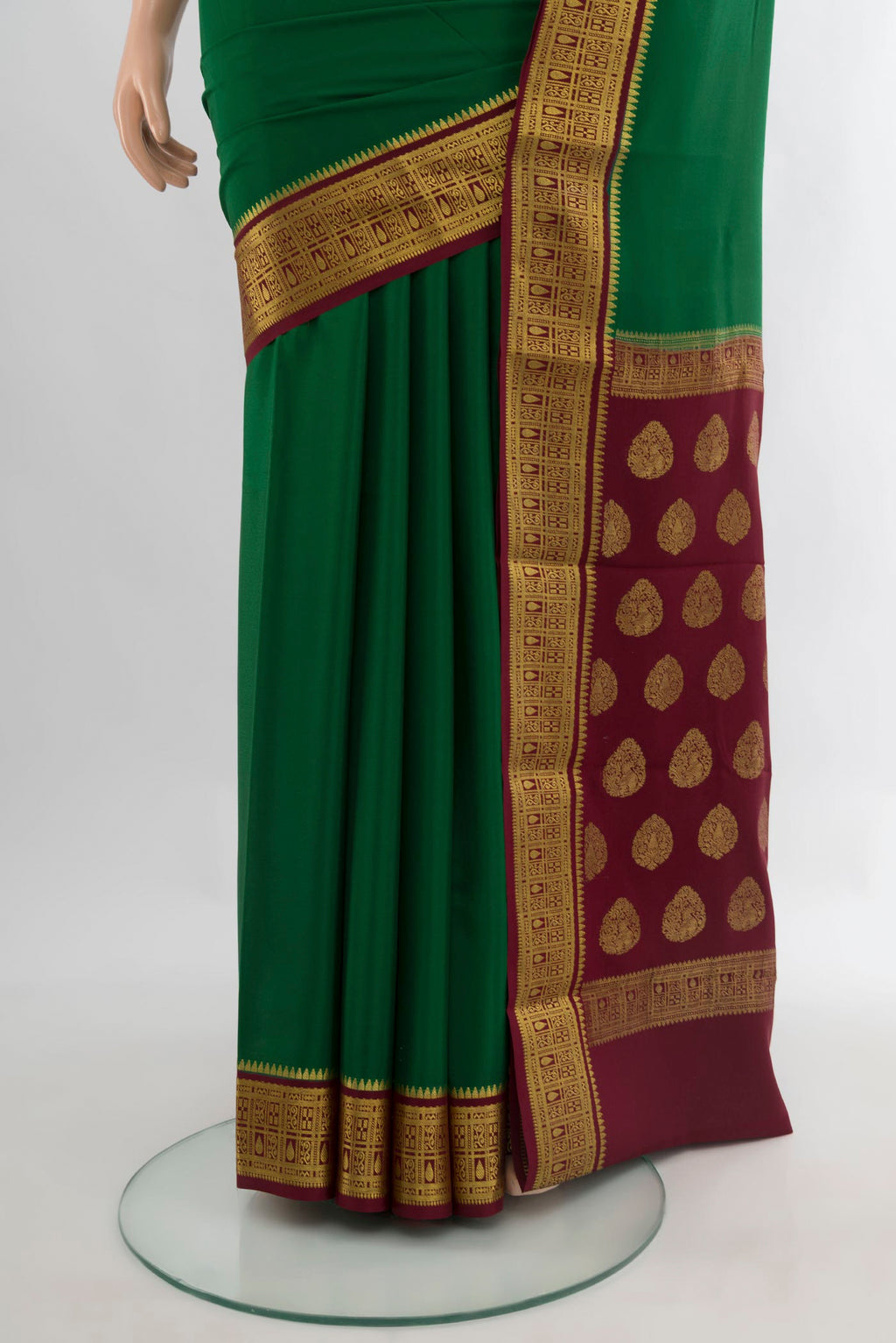 Pleats and pallu of Green Mysore Crepe Saree with Plain Body and Zari Border. 