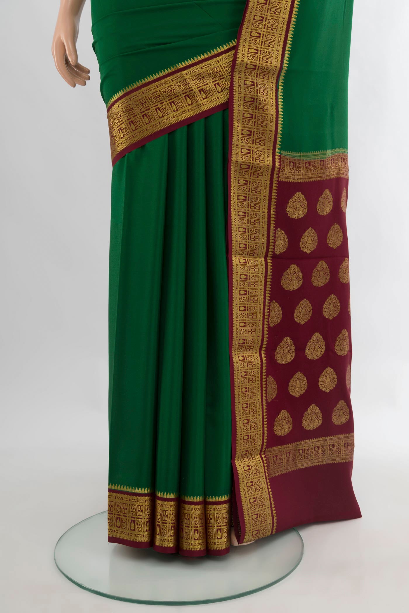 Pleats and pallu of Green Mysore Crepe Saree with Plain Body and Zari Border. 
