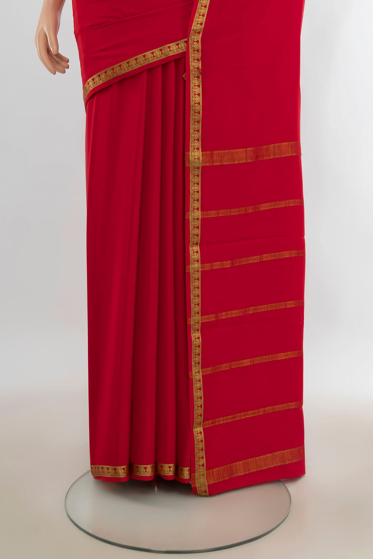 Pleats and pallu of Red Mysore Crepe Saree with Plain Body and Zari Border. 