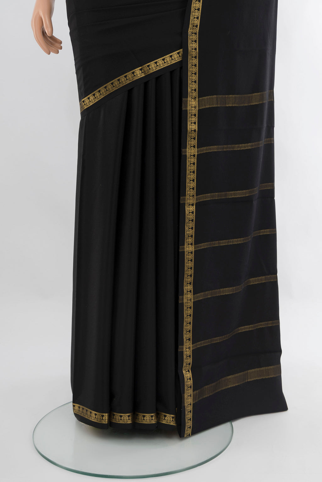 Pleats and pallu of Black Mysore Crepe Saree with Plain Body and Zari Border. 