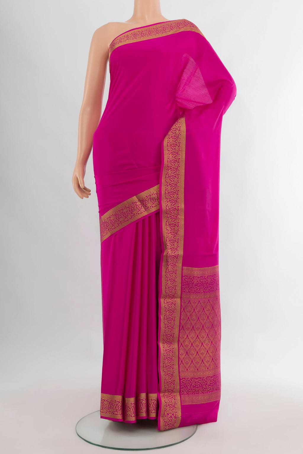 Rani Pink Mysore Crepe Saree with Plain Body and Zari Border.  displayed on a mannequin