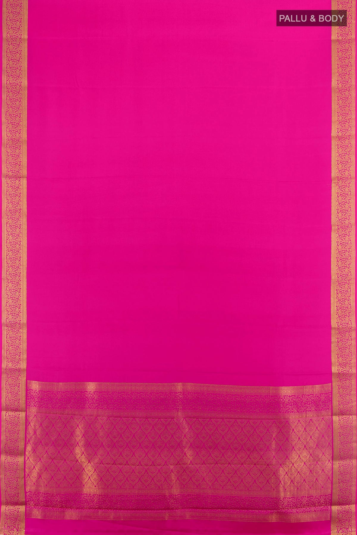 Flat view of Rani Pink Mysore Crepe Saree with Plain Body and Zari Border. 