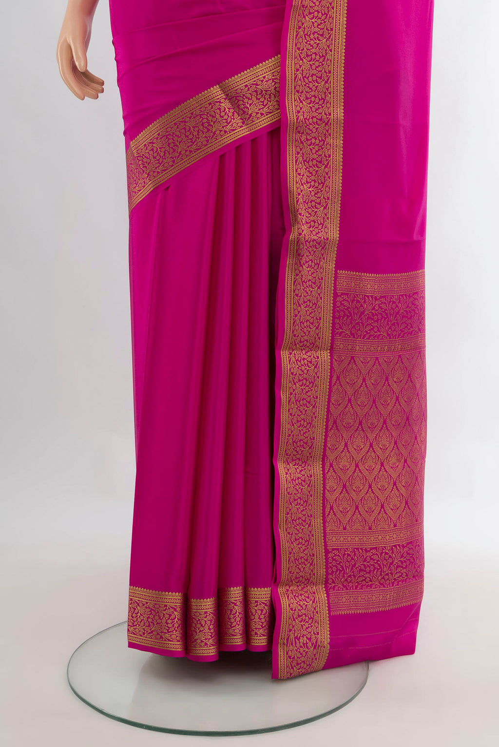 Pleats and pallu of Rani Pink Mysore Crepe Saree with Plain Body and Zari Border. 