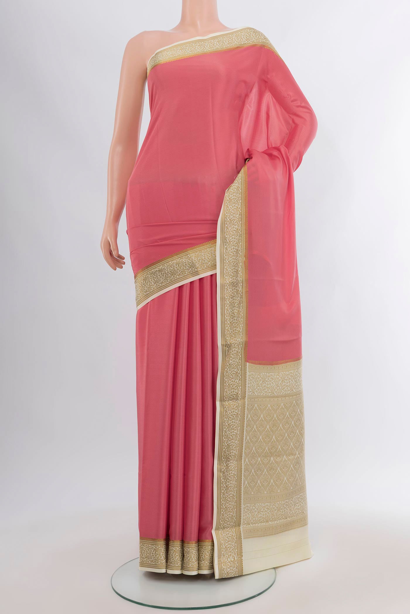 Rose pink Mysore Crepe Saree with Plain Body and Zari Border.  displayed on a mannequin