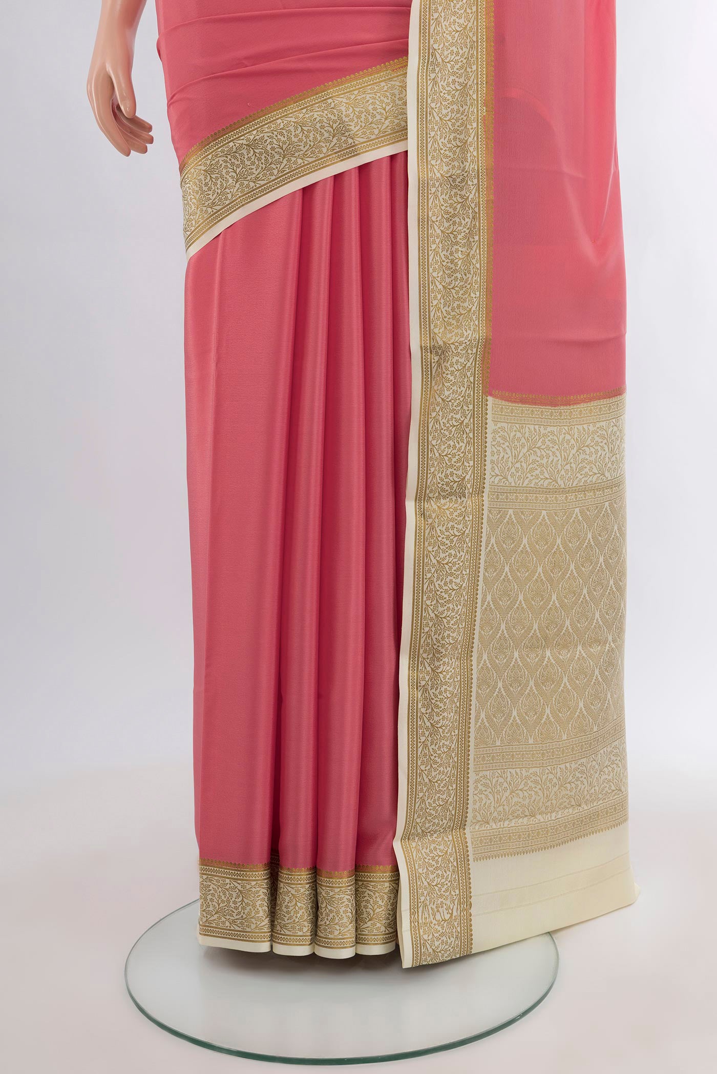 Pleats and pallu of Rose pink Mysore Crepe Saree with Plain Body and Zari Border. 