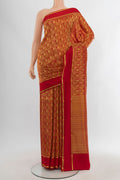 Red Mysore Crepe Saree with Zari Brocade on the body and Plain Border.  displayed on a mannequin
