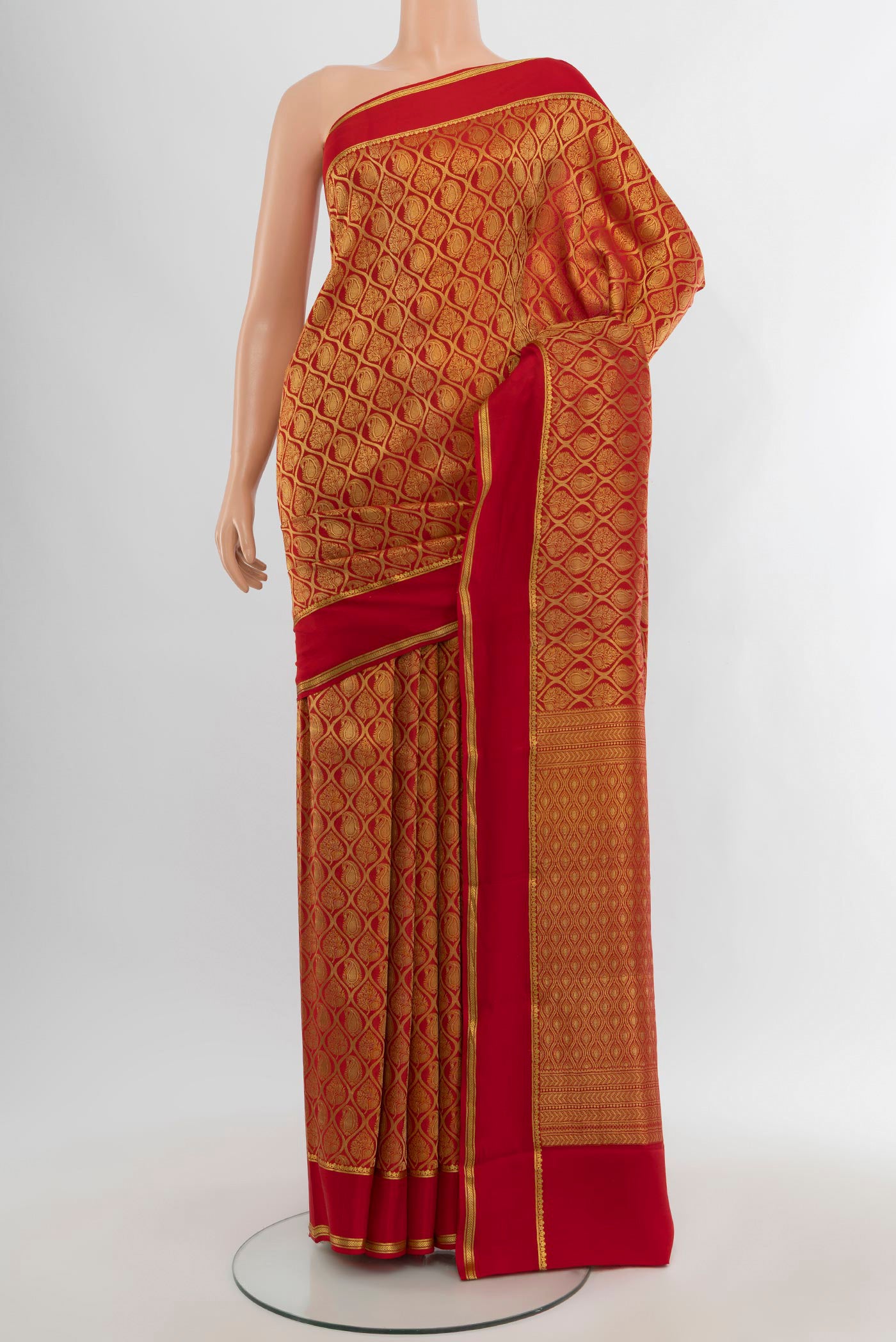 Red Mysore Crepe Saree with Zari Brocade on the body and Plain Border.  displayed on a mannequin
