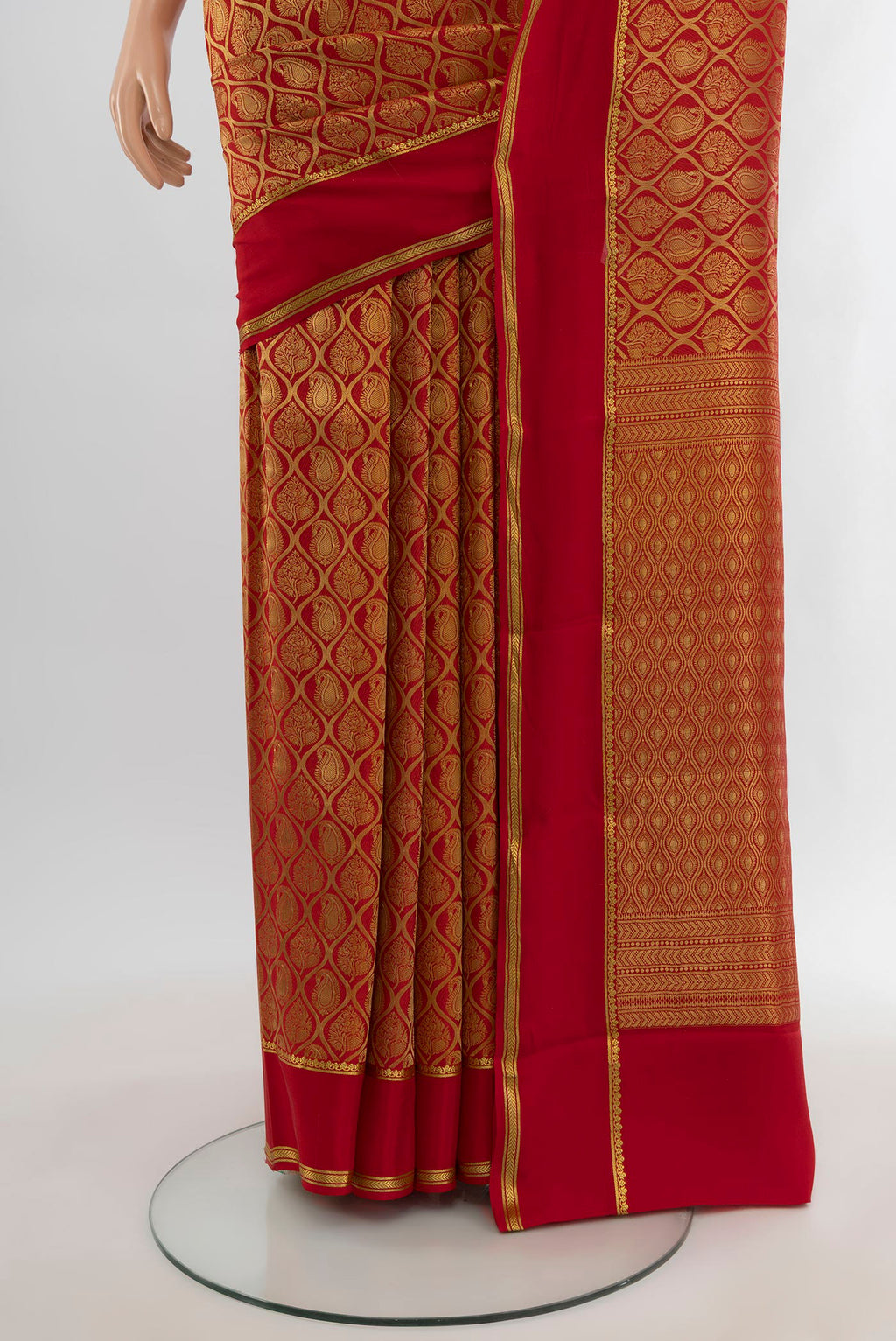 Pleats and pallu of Red Mysore Crepe Saree with Zari Brocade on the body and Plain Border. 
