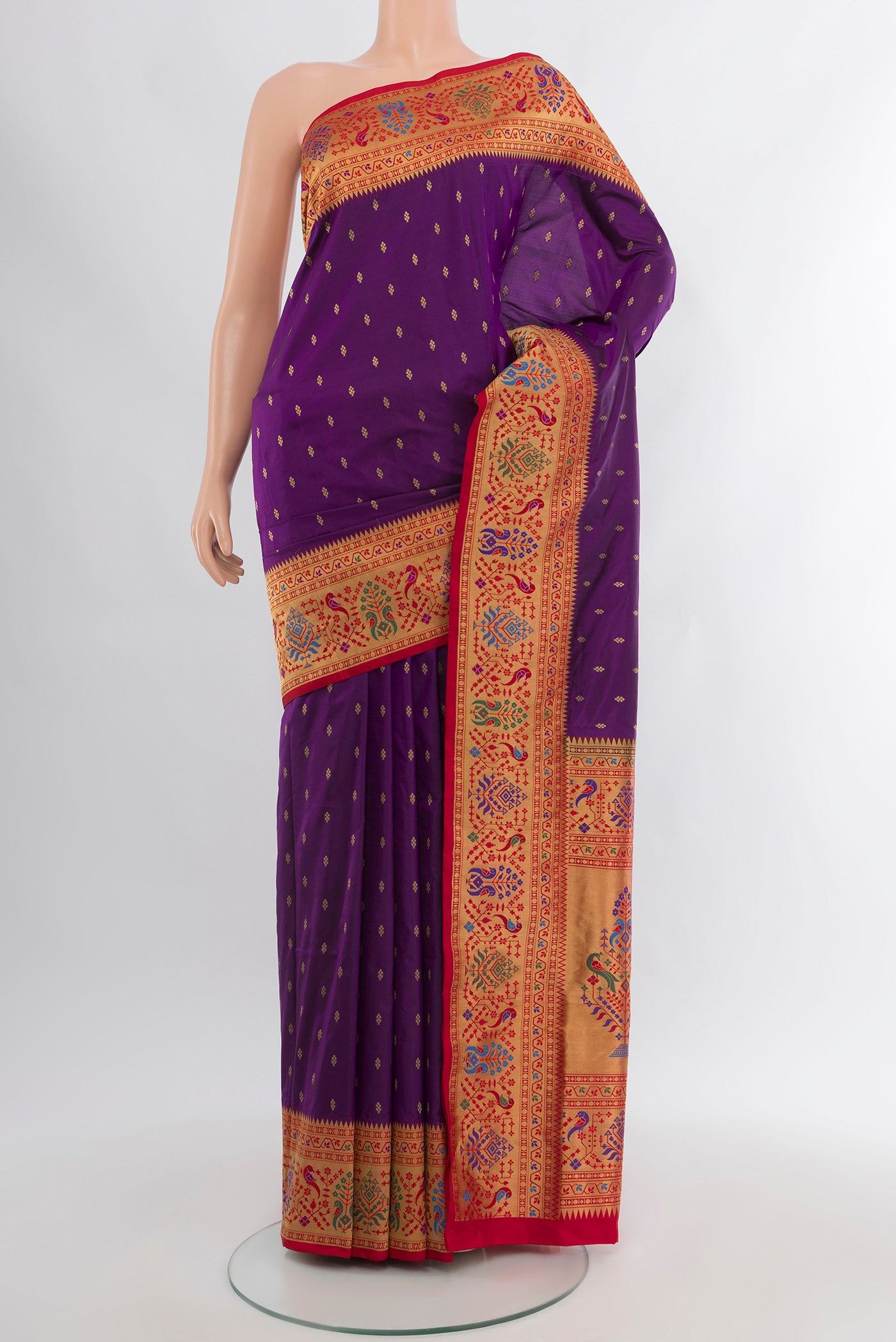 Violet Soft Silk Saree with Zari Butta on the body and Paithani Border.  displayed on a mannequin