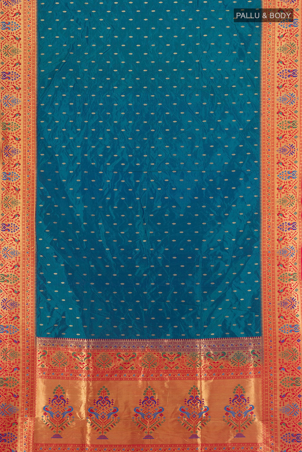 Flat view of Peacock Blue Soft Silk Saree with Zari Butta on the body and Silk Border. 