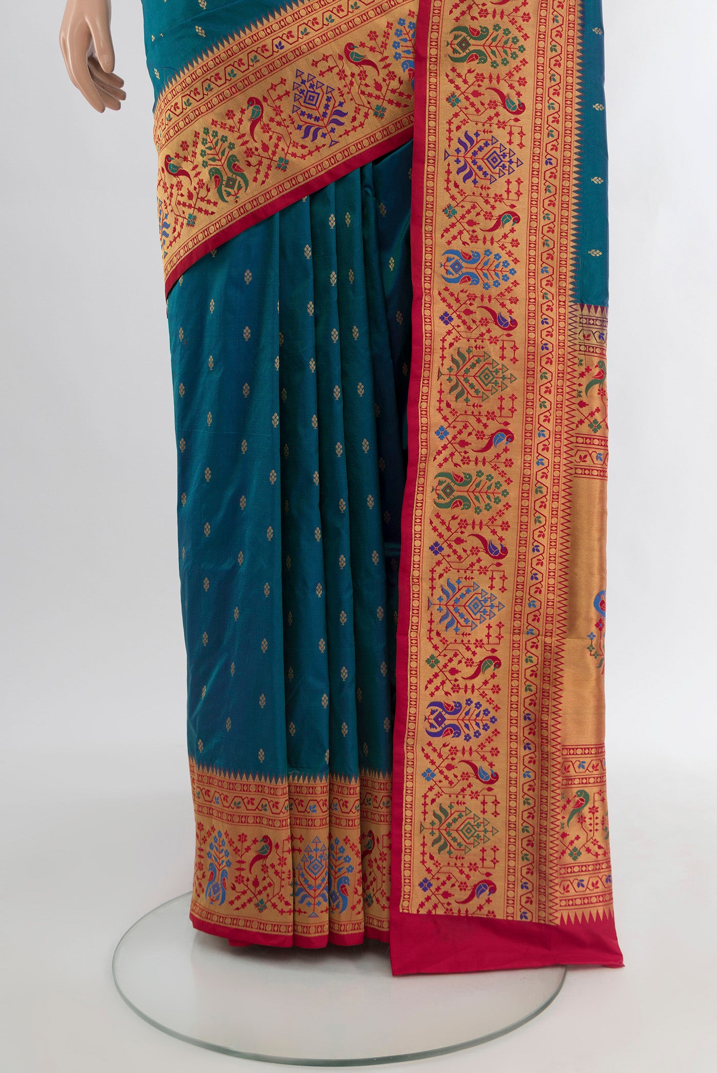 Pleats and pallu of Peacock Blue Soft Silk Saree with Zari Butta on the body and Silk Border. 