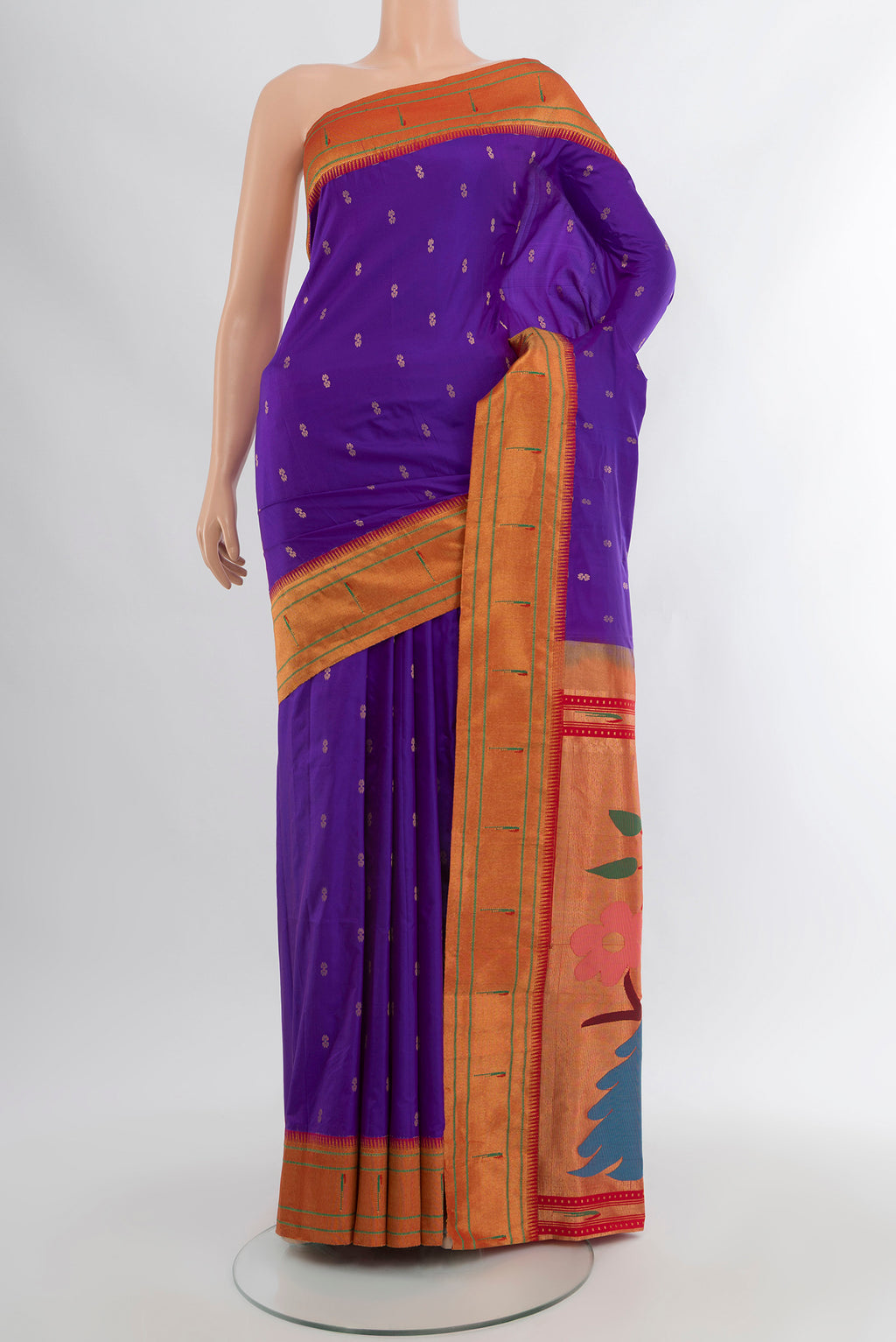 Violet Soft Silk Saree with Zari Butta on the body and Silk Border.  displayed on a mannequin