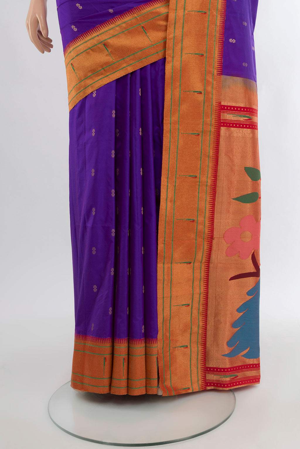 Pleats and pallu of Violet Soft Silk Saree with Zari Butta on the body and Silk Border. 